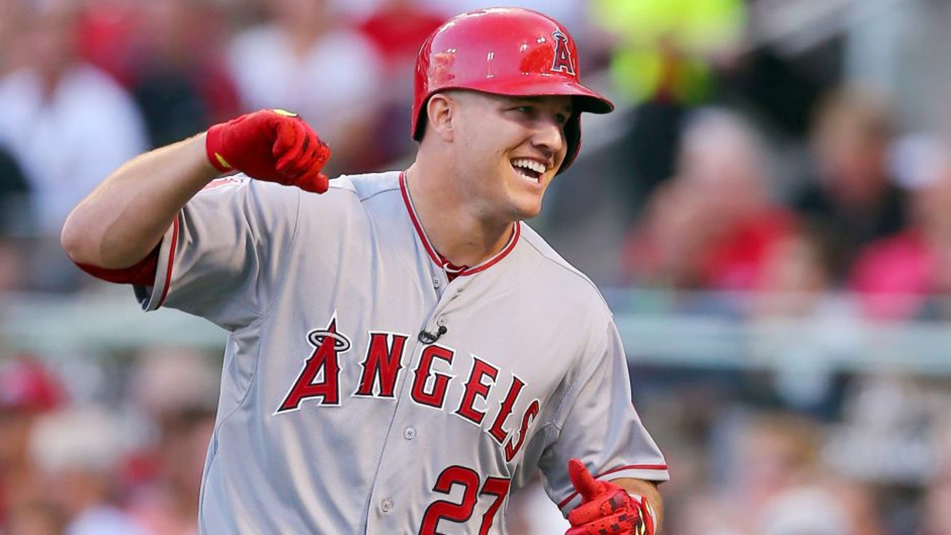 American League All-Star Mike Trout #27 of the Los Angeles Angels of Anaheim celebrates after hitting a lead off home run in the first inning against National League All-Star Zack Greinke #21 of the Los Angeles Dodgers during the 86th MLB All-Star Game at the Great American Ball Park on July 14, 2015 in Cincinnati, Ohio. (Photo by Elsa/Getty Images)
