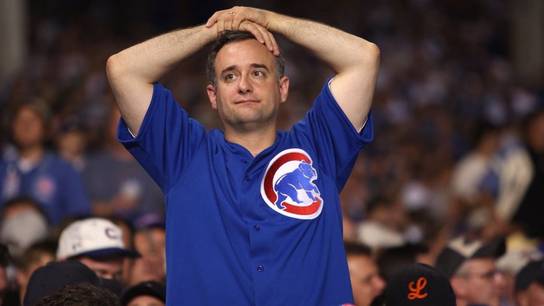 CHICAGO - OCTOBER 06: A fan of the Chicago Cubs looks on dejected against the Arizona Diamondbacks during Game Three of the National League Divisional Series at Wrigley Field on October 6, 2007 in Chicago, Illinois. (Photo by Jamie Squire/Getty Images)