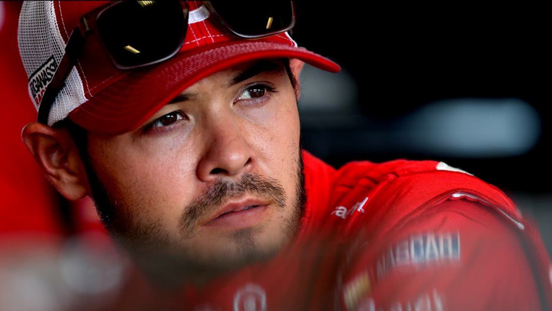 SPARTA, KY - JULY 08: Kyle Larson, driver of the #42 Target Chevrolet, stands in the garage area during practice for the NASCAR Sprint Cup Series Quaker State 400 at Kentucky Speedway on July 8, 2016 in Sparta, Kentucky. (Photo by Jerry Markland/Getty Images)