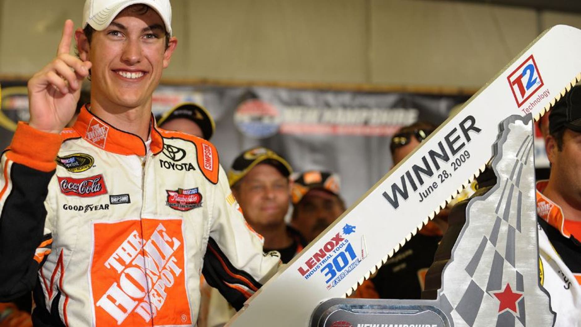 LOUDON, NH - JUNE 28: Joey Logano, driver of the #20 Home Depot Toyota, celebrates winning the NASCAR Sprint Cup Series LENOX Industrial Tools 301 at New Hampshire Motor Speedway on June 28, 2009 in Loudon, New Hampshire. Logano won the rain shortened race with 27 laps remaining. (Photo by Drew Hallowell/Getty Images for NASCAR)