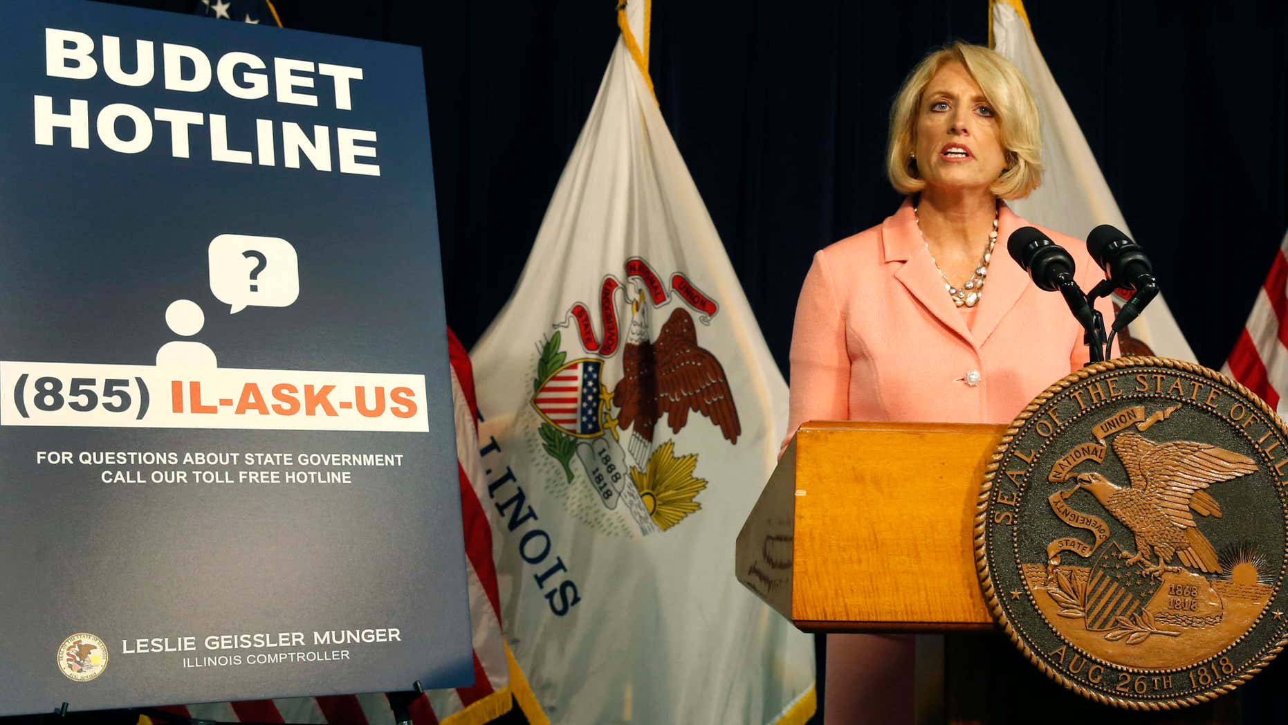 Illinois Comptroller Leslie Geissler Munger begins a news conference on the state budget Thursday, July 14, 2016, in Chicago.