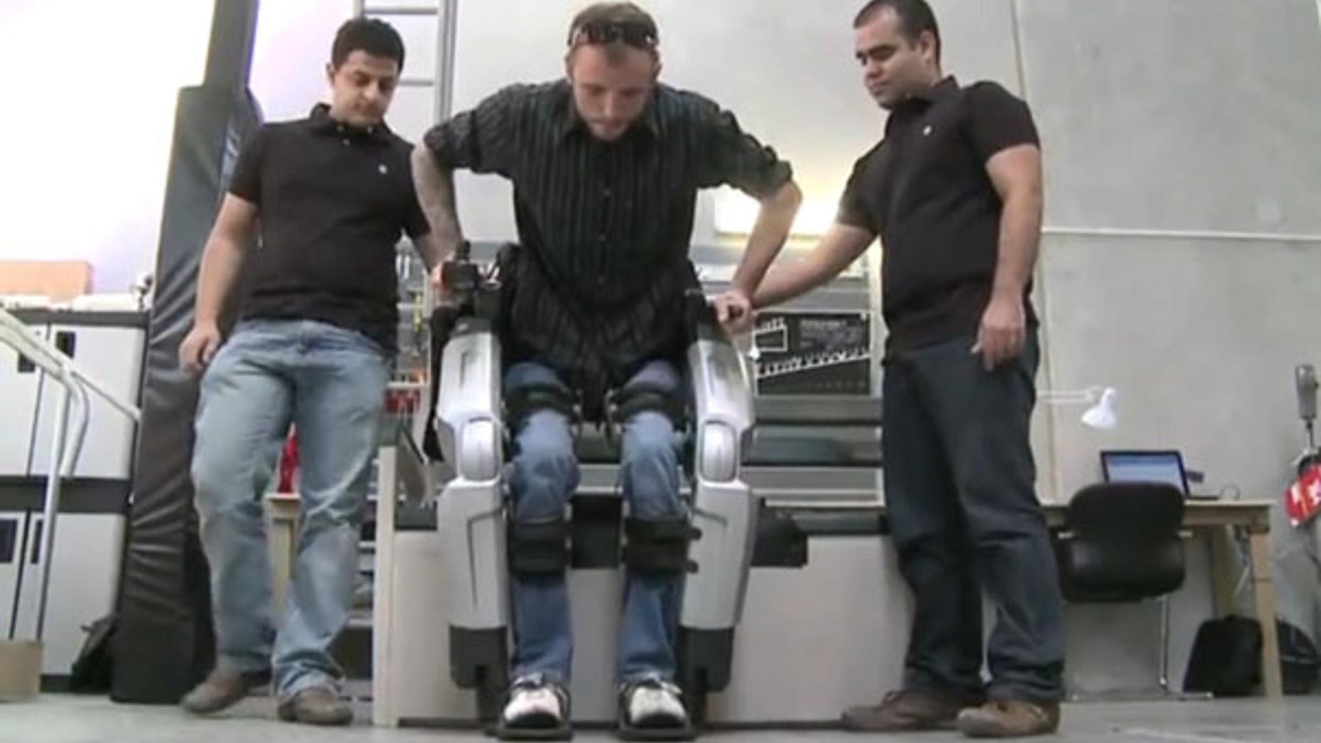 Hayden Allen, who injured his spinal cord five years ago, tests out Rex, the robotic exoskeleton. "I'll never forget what it was like to see my feet walking under me the first time I used Rex," said Hayden.