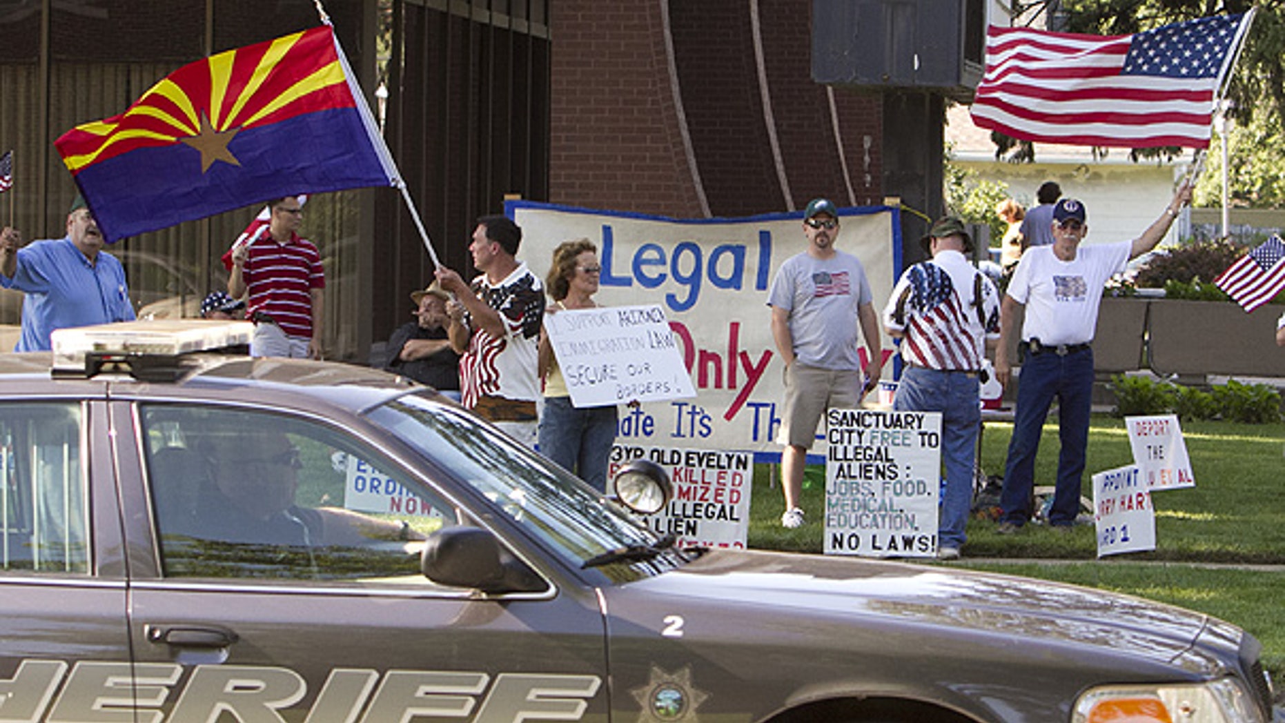July 13: A group demonstrates against illegal immigration outside the Fremont, Nebraska, city hall.