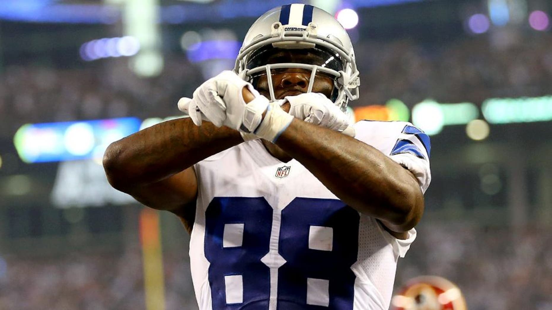 ARLINGTON, TX - OCTOBER 27: Dez Bryant #88 of the Dallas Cowboys celebrates his touchdown against the Washington Redskins during the first half at AT&T Stadium on October 27, 2014 in Arlington, Texas. (Photo by Ronald Martinez/Getty Images)
