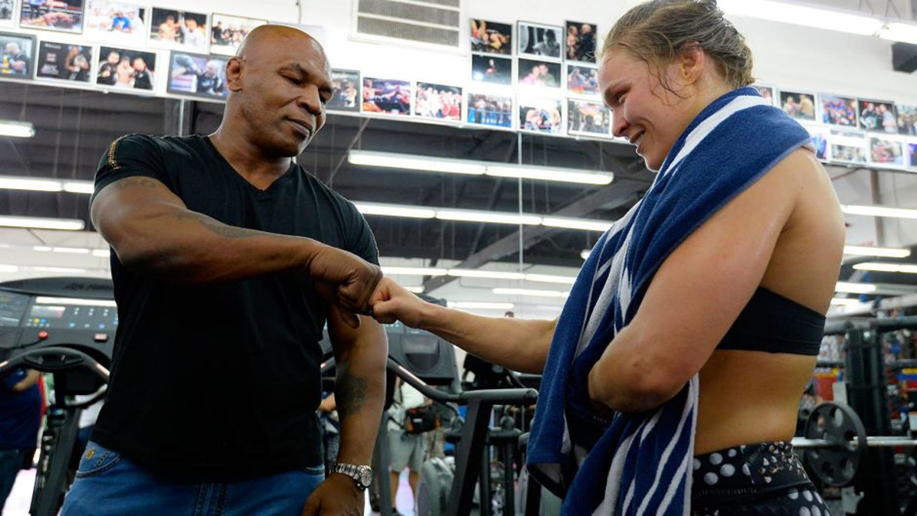 GLENDALE, CA - JULY 15: Former boxer Mike Tyson meets UFC Bantamweight champion Ronda Rousey during a media training session at the Glendale Fight Club on July 15, 2015 in Glendale, California. (Photo by Robert Laberge/Zuffa LLC/Zuffa LLC via Getty Images)