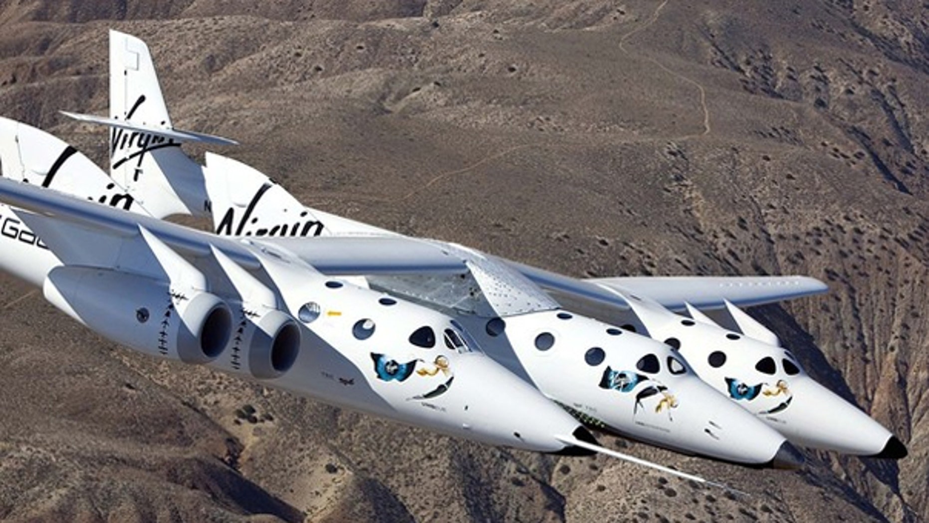 March 22: Virgin Galactic's SpaceShipTwo, which can hold six passengers, is seen on its maiden flight over the Mojave Desert.