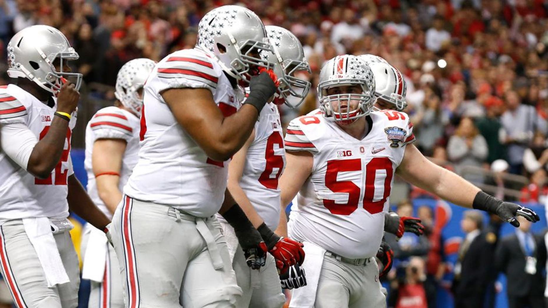 Jan 1, 2015; New Orleans, LA, USA; Ohio State Buckeyes center Jacoby Boren (50) signals prior to setting the line against the Alabama Crimson Tide in the 2015 Sugar Bowl at Mercedes-Benz Superdome. Mandatory Credit: Matthew Emmons-USA TODAY Sports