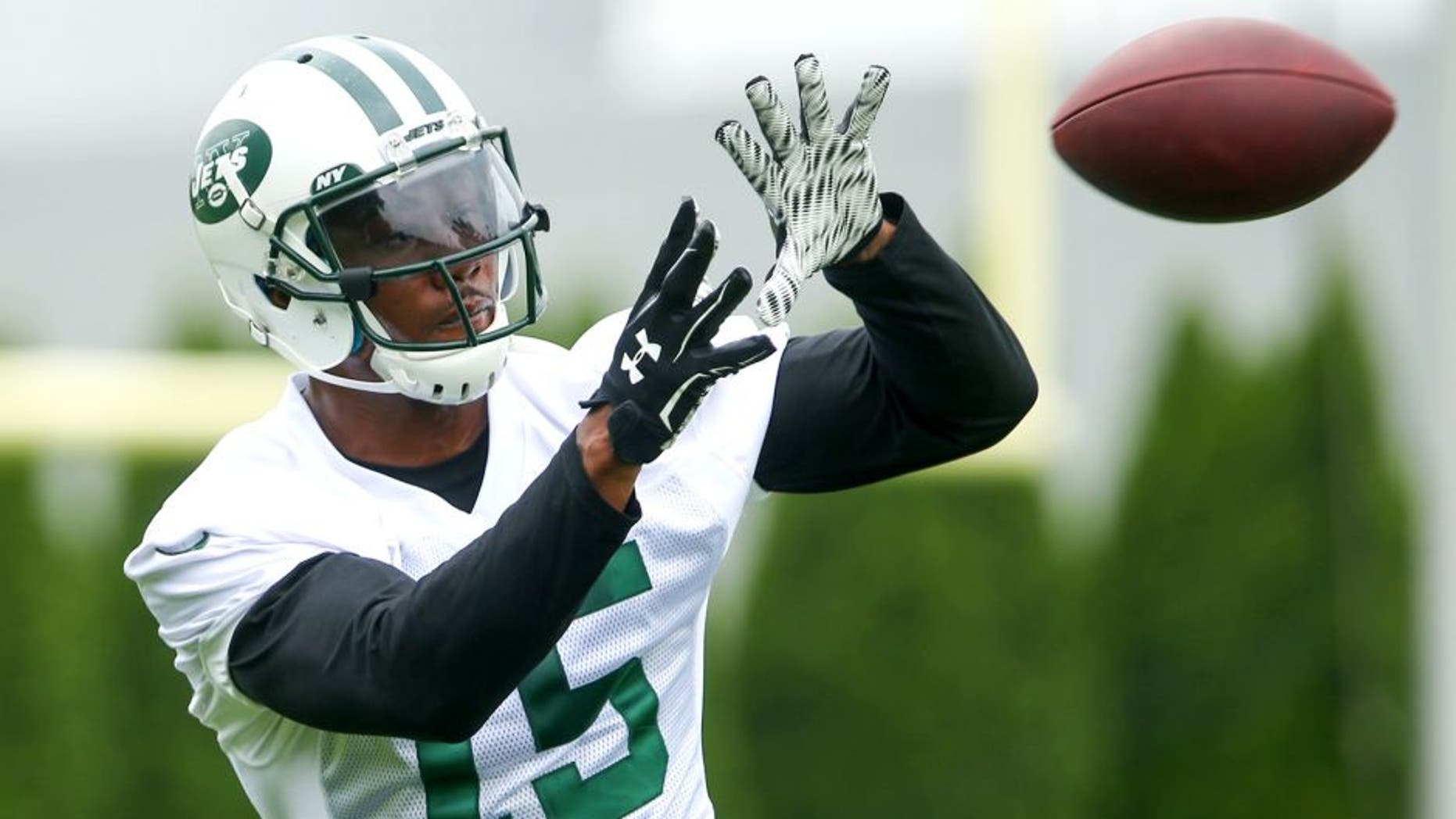 May 27, 2015; East Rutherford, NJ, USA; New York Jets wide receiver Brandon Marshall (15) catches a pass during organized team activities at Atlantic Health Jets Training Center. Mandatory Credit: Ed Mulholland-USA TODAY Sports