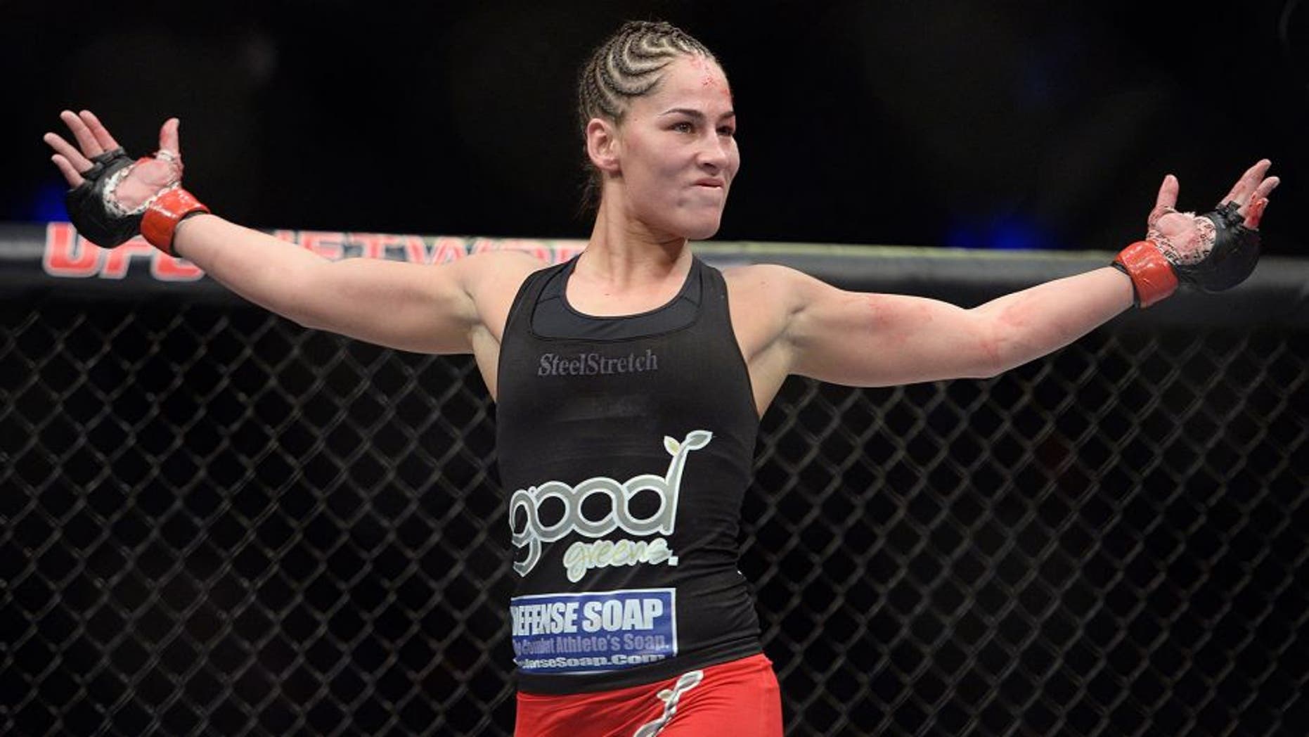 MEXICO CITY, MEXICO - NOVEMBER 15: Jessica Eye celebrates after defeating Leslie Smith in their women's bantamweight bout during the UFC 180 event at Arena Ciudad de Mexico on November 15, 2014 in Mexico City, Mexico. (Photo by Jeff Bottari/Zuffa LLC/Zuffa LLC via Getty Images)