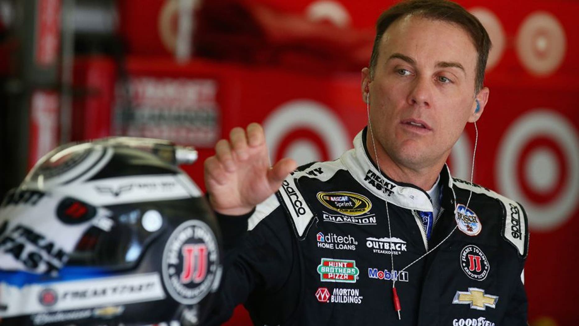 LOUDON, NH - JULY 15: Kevin Harvick, driver of the #4 Jimmy John's Chevrolet, stands in the garage area during practice for the NASCAR Sprint Cup Series New Hampshire 301 at New Hampshire Motor Speedway on July 16, 2016 in Loudon, New Hampshire. (Photo by Sarah Crabill/NASCAR via Getty Images)