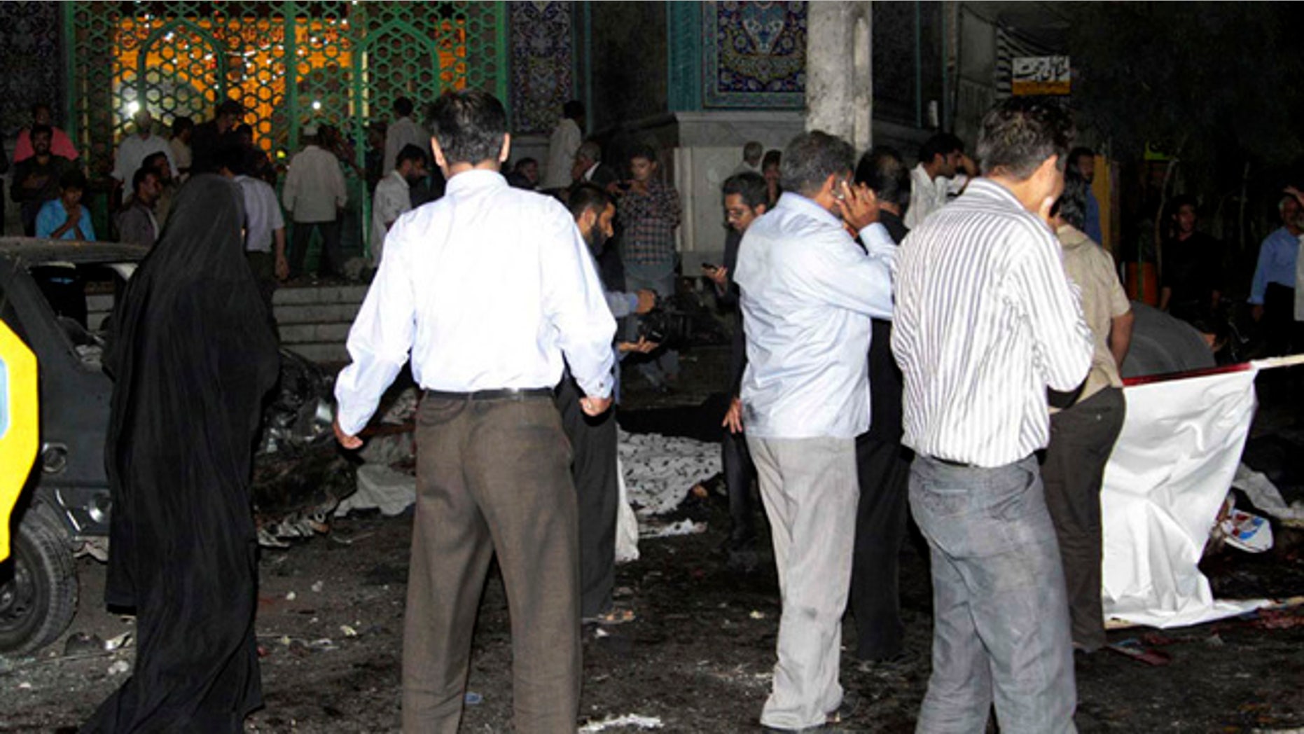 July 15: In this picture released by the Iran's official Islamic Republic News Agency (IRNA), people gather at the scene of bomb blasts in the provincial capital of Zahedan, Iran.