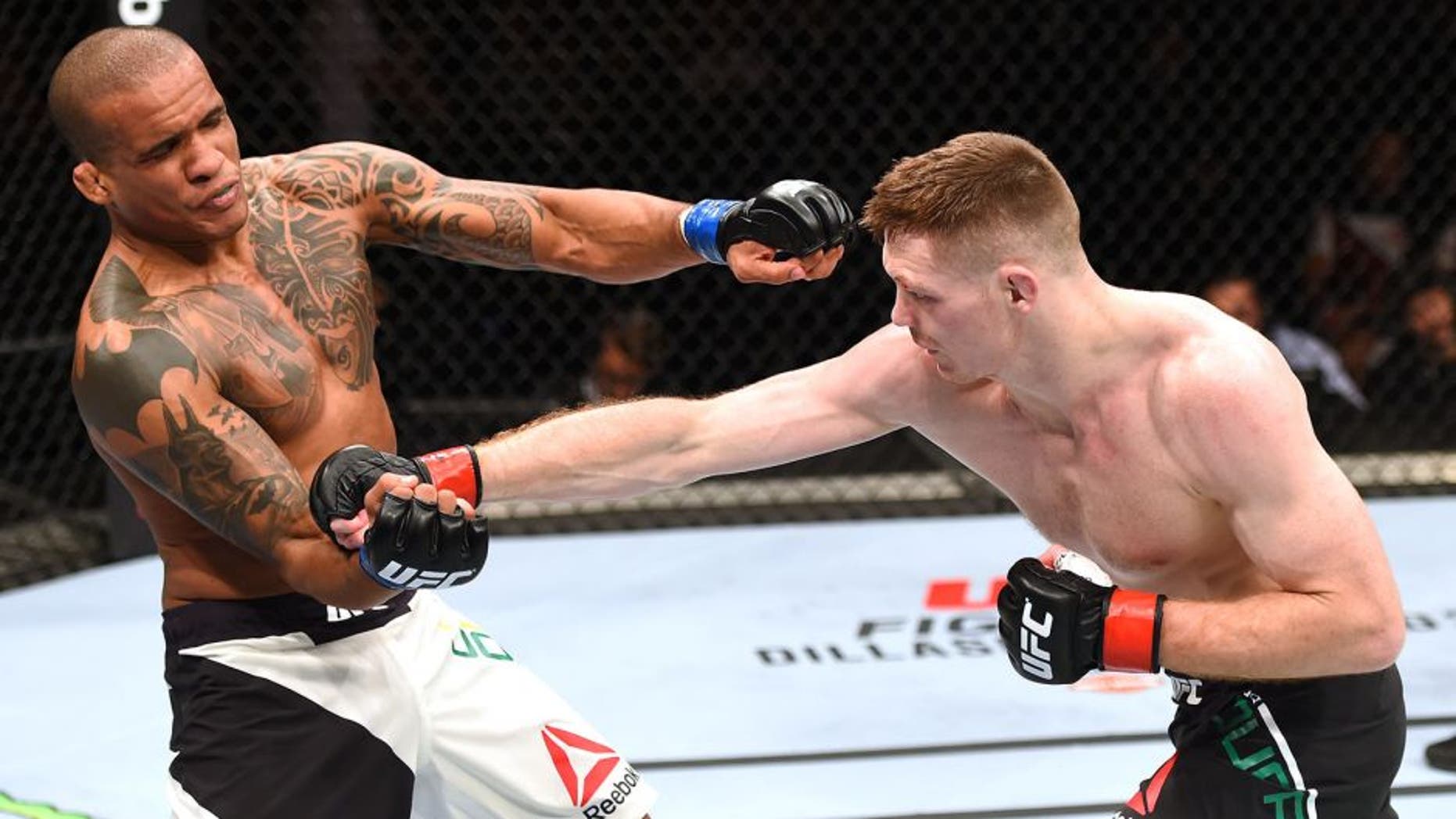 GLASGOW, SCOTLAND - JULY 18: (R-L) Joe Duffy of Ireland punches Ivan Jorge of Brazil in their lightweight fight during the UFC Fight Night event inside the SSE Hydro on July 18, 2015 in Glasgow, Scotland. (Photo by Josh Hedges/Zuffa LLC/Zuffa LLC via Getty Images)