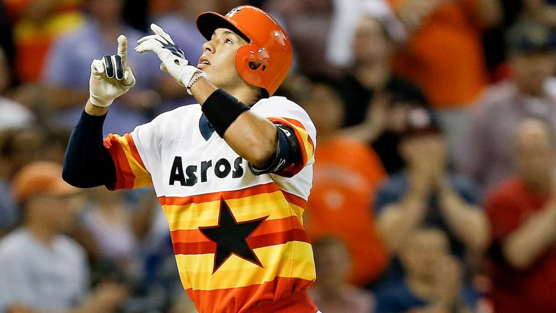 HOUSTON, TX - JULY 18: Carlos Correa #1 of the Houston Astros hits a home run in the seventh inning against the Texas Rangers at Minute Maid Park on July 18, 2015 in Houston, Texas. (Photo by Bob Levey/Getty Images)
