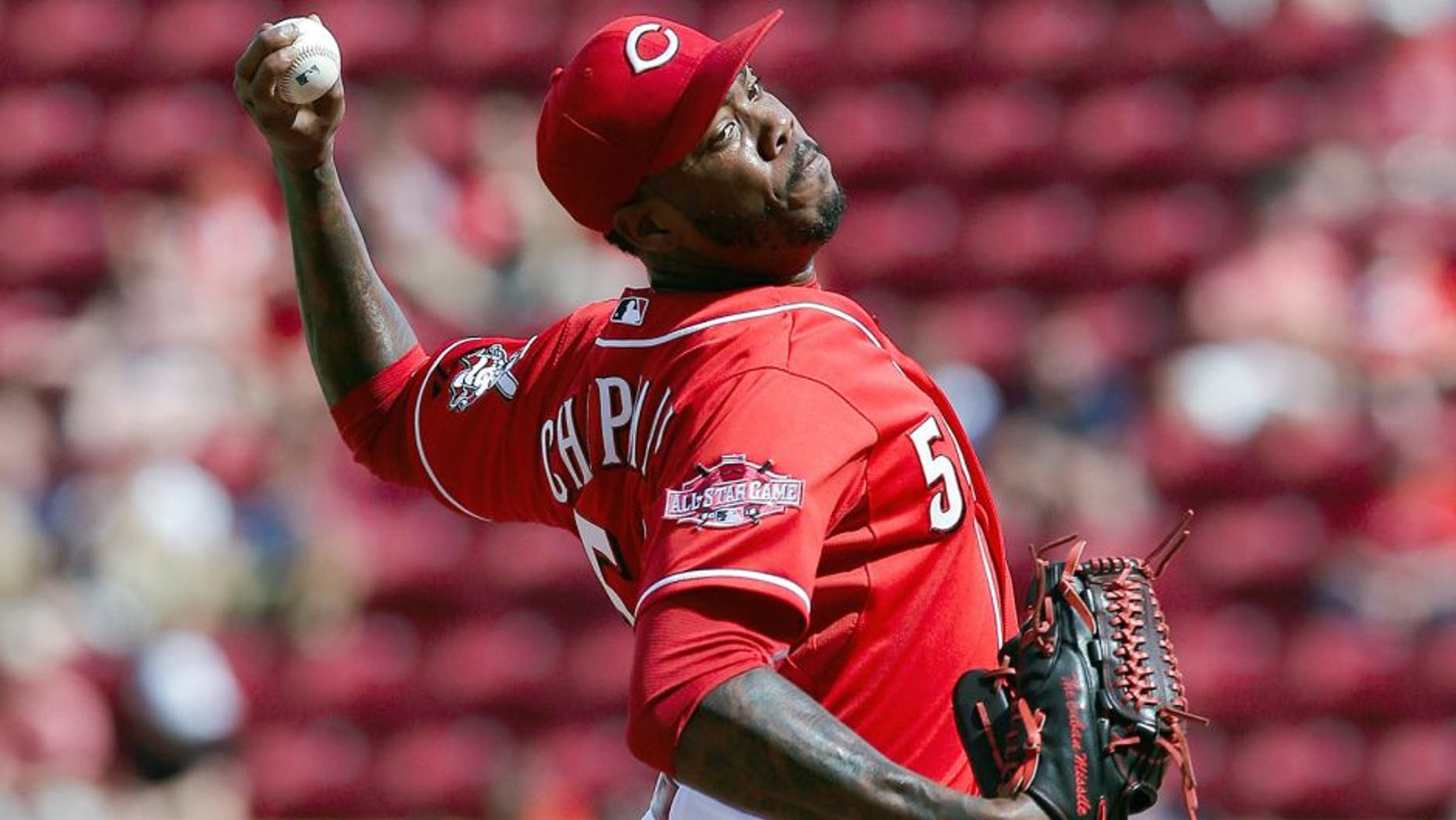 Cincinnati Reds relief pitcher Aroldis Chapman throws in the ninth inning of a baseball game against the Cleveland Indians, Sunday, July 19, 2015, in Cincinnati. (AP Photo/John Minchillo)