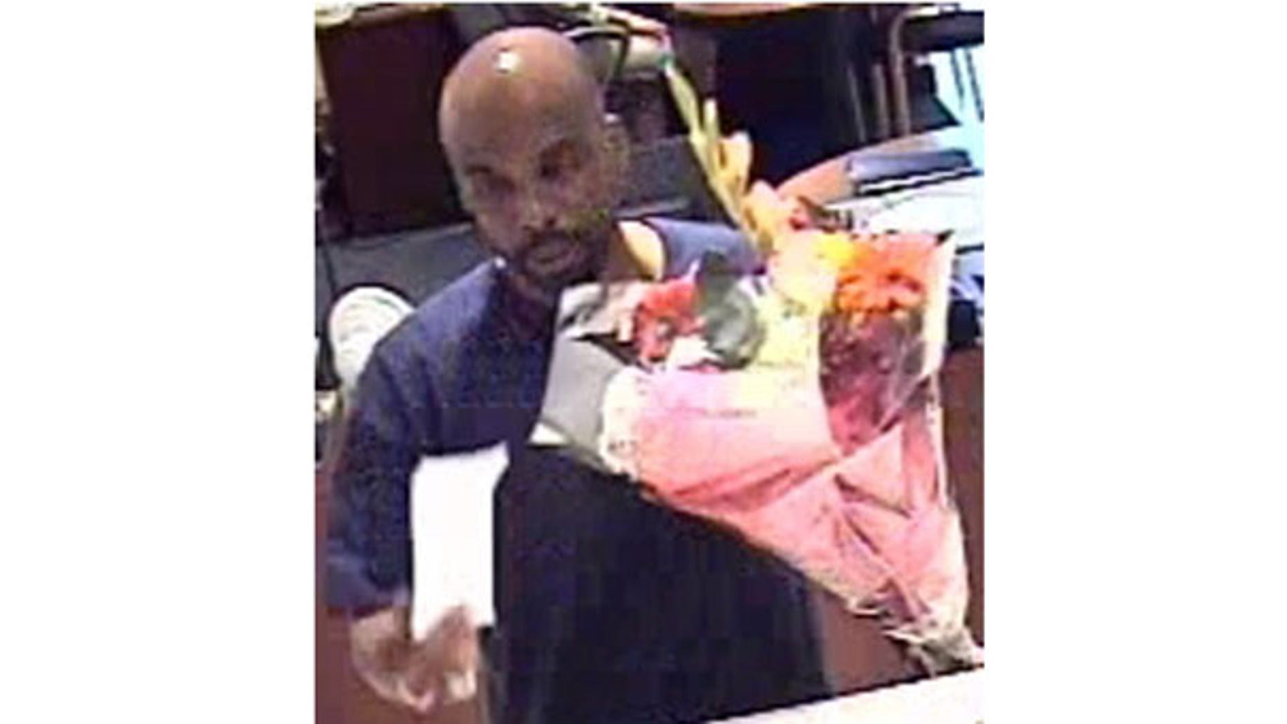 July 15: Security footage shows a man robbing a New York City bank armed only with a bouquet of fresh flowers.