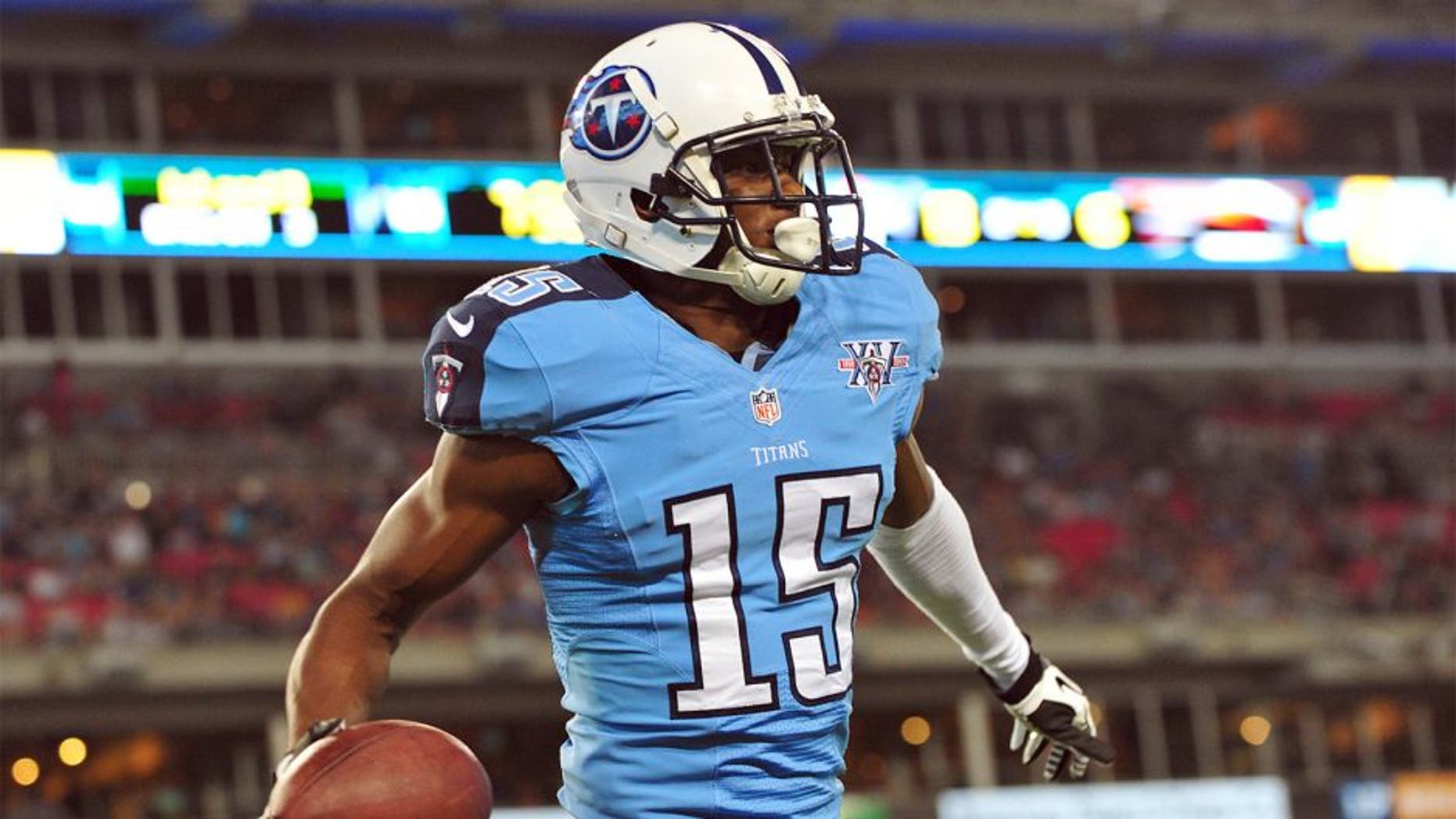 Aug 24, 2013; Nashville, TN, USA; Tennessee Titans wide receiver Justin Hunter (15) celebrates after scoring a touchdown against the Atlanta Falcons during the second half at LP Field. The Titans beat the Falcons 27-16. Mandatory Credit: Don McPeak-USA TODAY Sports