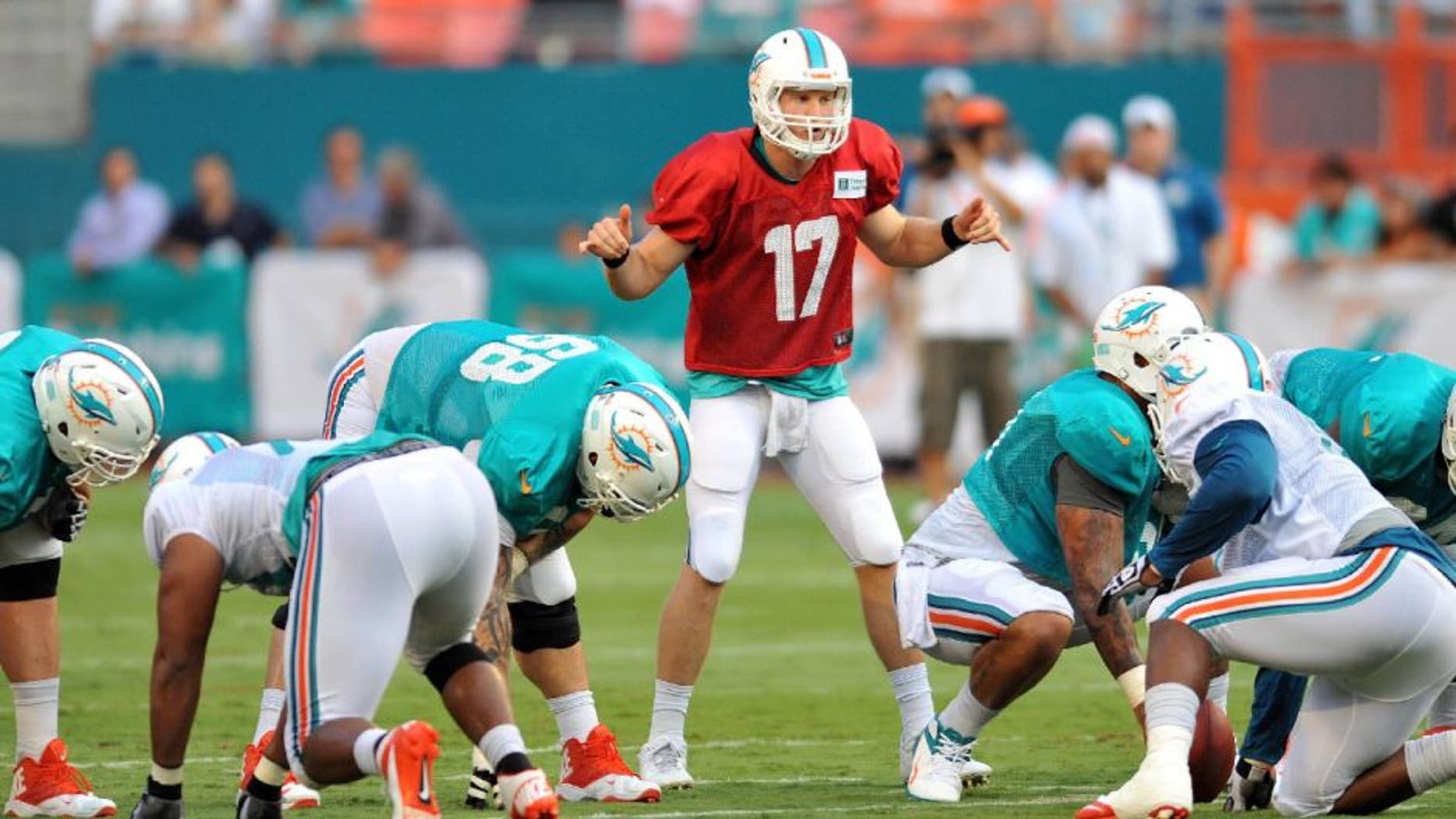 Jul 29, 2013; Miami, FL, USA; Miami Dolphins quarterback Ryan Tannehill (17) calls out plays at the line of scrimmage during a scrimmage at Sun Life Stadium. Mandatory Credit: Steve Mitchell-USA TODAY Sports
