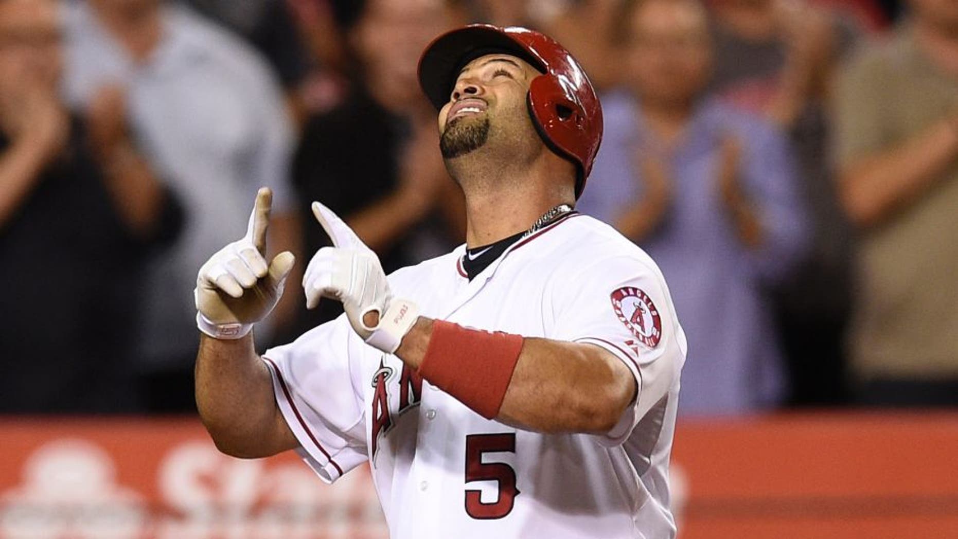 Jul 20, 2015; Anaheim, CA, USA; Los Angeles Angels first baseman Albert Pujols (5) celebrates after running the bases off of a solo home run against the Boston Red Sox during the seventh inning at Angel Stadium of Anaheim. Mandatory Credit: Kelvin Kuo-USA TODAY Sports