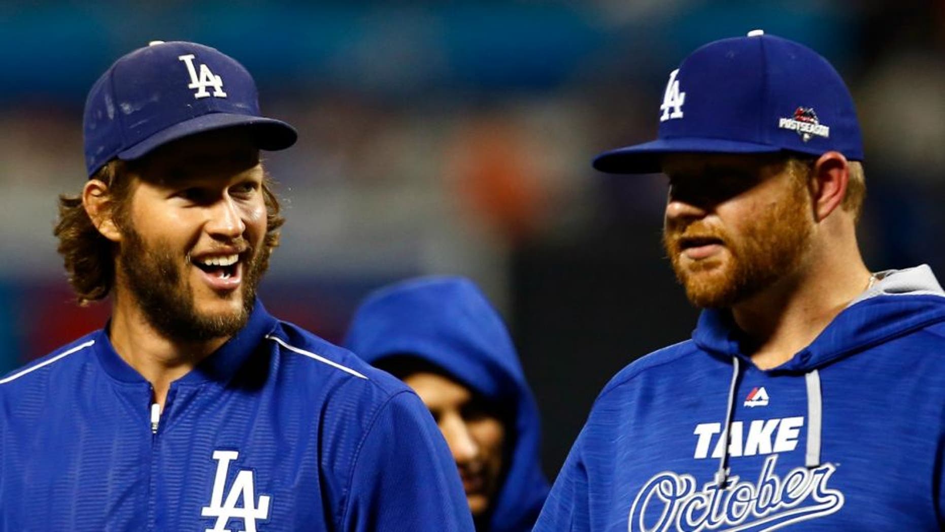 during game four of the National League Division Series at Citi Field on October 13, 2015 in New York City.,NEW YORK, NY - OCTOBER 13: Clayton Kershaw #22 and Brett Anderson #35 of the Los Angeles Dodgers smile after defeating the New York Mets in game four of the National League Division Series at Citi Field on October 13, 2015 in New York City. The Dodgers defeated the Mets with a score of 3 to 1. (Photo by Mike Stobe/Getty Images)
