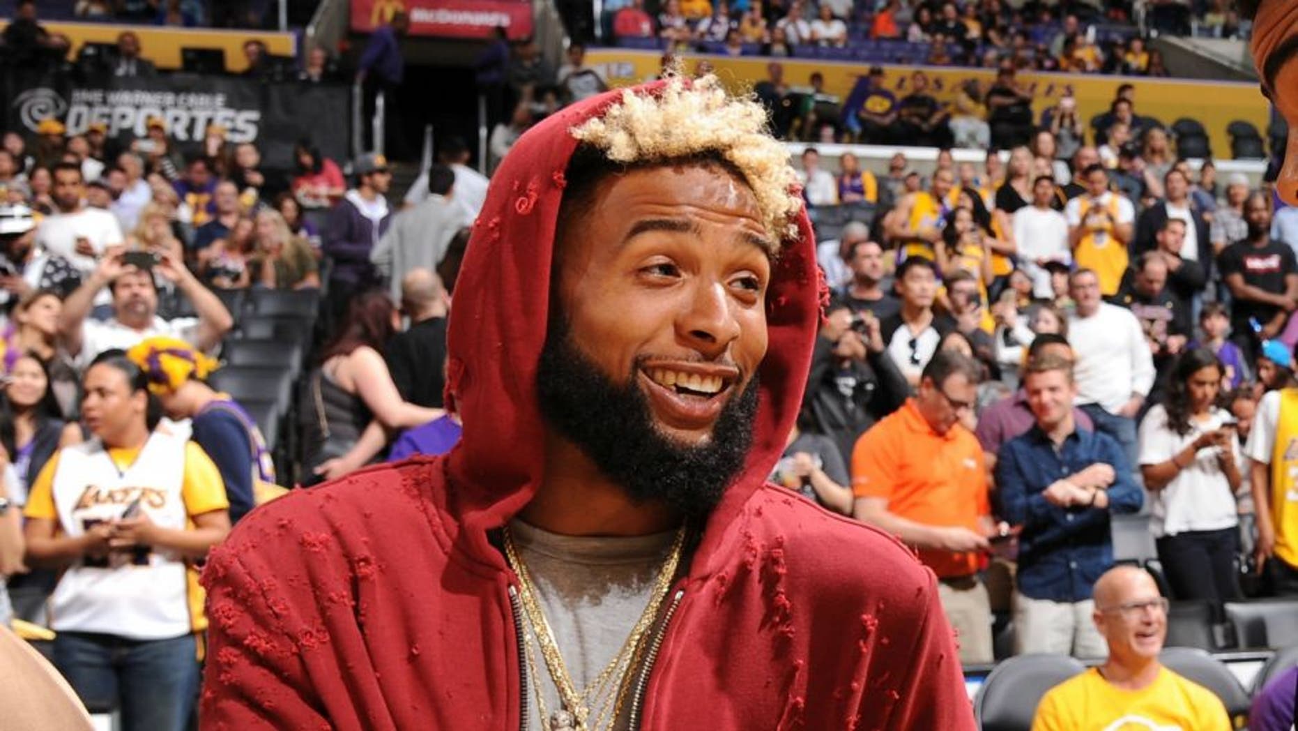 LOS ANGELES, CA - MARCH 25: New York Giant, O'Dell Beckham Jr. shakes hands with D'Angelo Russell #1 of the Los Angeles Lakers before the game against the Denver Nuggets on March 25, 2016 at STAPLES Center in Los Angeles, California. NOTE TO USER: User expressly acknowledges and agrees that, by downloading and/or using this Photograph, user is consenting to the terms and conditions of the Getty Images License Agreement. Mandatory Copyright Notice: Copyright 2016 NBAE (Photo by Andrew D. Bernstein/NBAE via Getty Images)