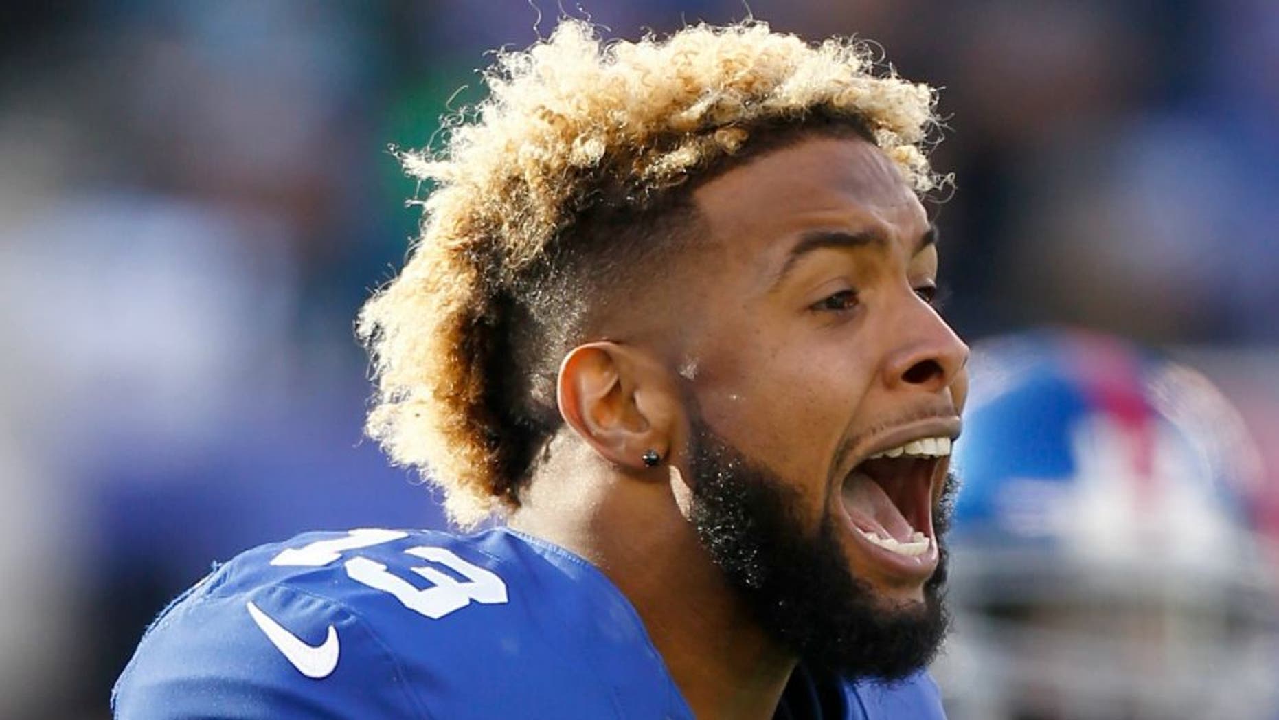 during their game at MetLife Stadium on December 20, 2015 in East Rutherford, New Jersey.,EAST RUTHERFORD, NJ - DECEMBER 20: Odell Beckham #13 of the New York Giants reacts after a scuffle in the first quarter against the Carolina Panthers during their game at MetLife Stadium on December 20, 2015 in East Rutherford, New Jersey. (Photo by Jeff Zelevansky/Getty Images)