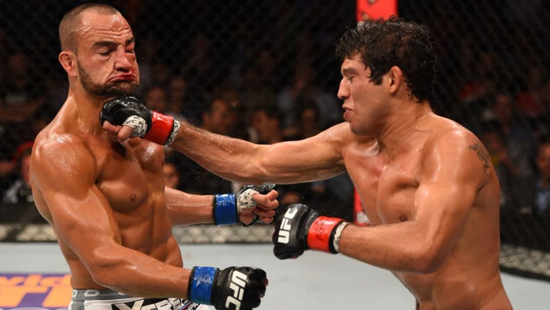MEXICO CITY, MEXICO - JUNE 13: (R-L) Gilbert Melendez of the United States punches Eddie Alvarez of the United Statesin their lightweight bout during the UFC 188 event at the Arena Ciudad de Mexico on June 13, 2015 in Mexico City, Mexico. (Photo by Josh Hedges/Zuffa LLC/Zuffa LLC via Getty Images)
