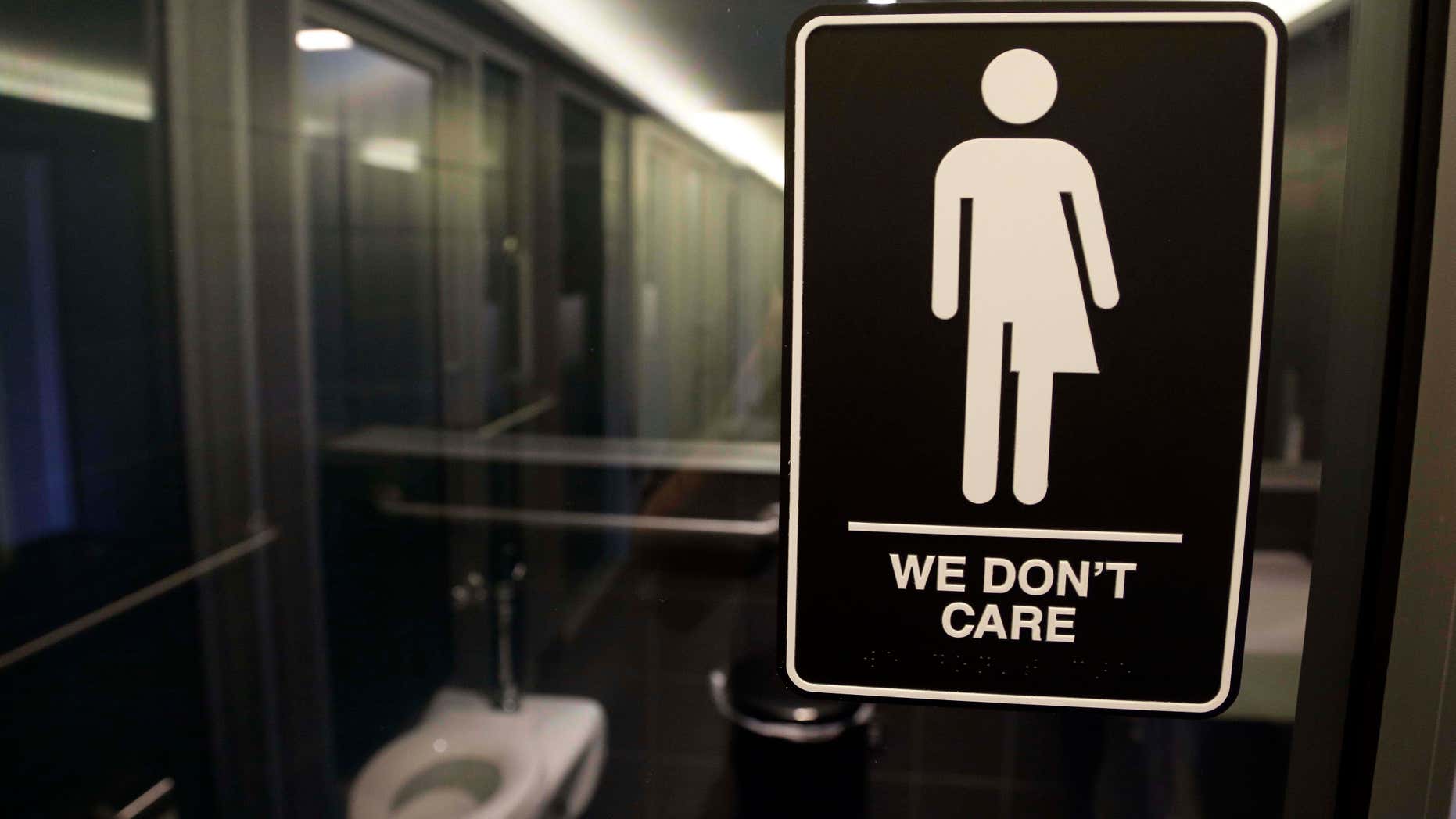 In this Thursday, May 12, 2016 file photo, signage is seen outside a restroom at 21c Museum Hotel in Durham, N.C.
