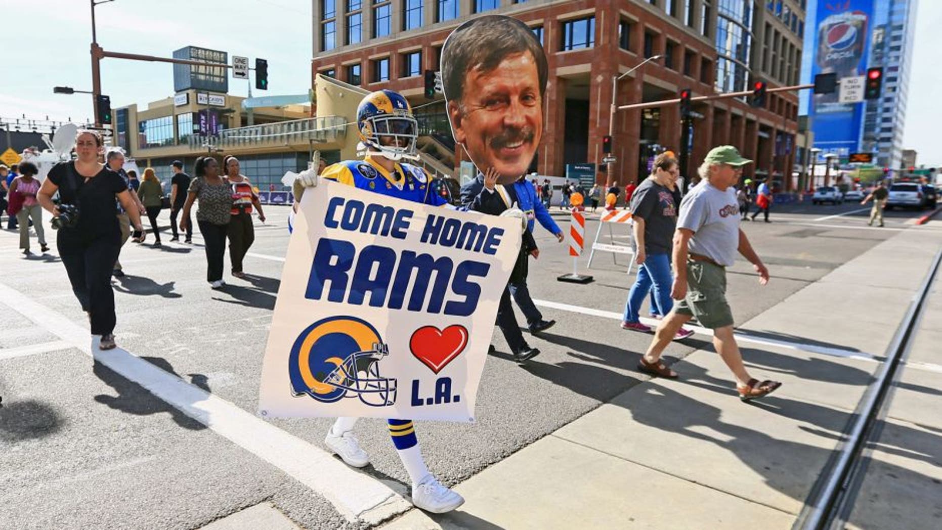 Jan 28, 2015; Phoenix, AZ, USA; St. Louis Rams super fan Mike Griffin holds a sign to move the team to Los Angeles. Mandatory Credit: Andrew Weber-USA TODAY Sports