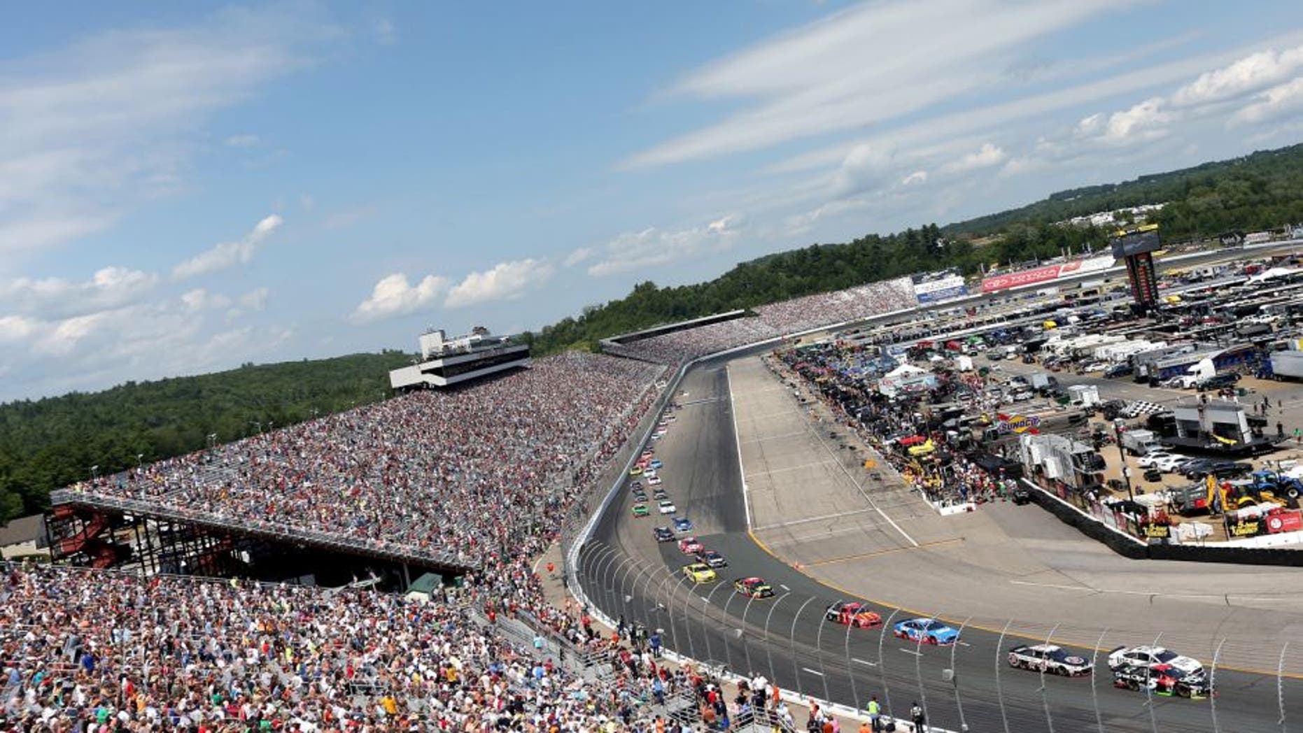 LOUDON, NH - JULY 19: Brad Keselowski, driver of the #2 Miller Lite Ford, and Kasey Kahne, driver of the #5 Great Clips Chevrolet, lead the field into turn one during the NASCAR Sprint Cup Series 5-Hour ENERGY 301 at New Hampshire Motor Speedway on July 19, 2015 in Loudon, New Hampshire. (Photo by Nick Laham/Getty Images)