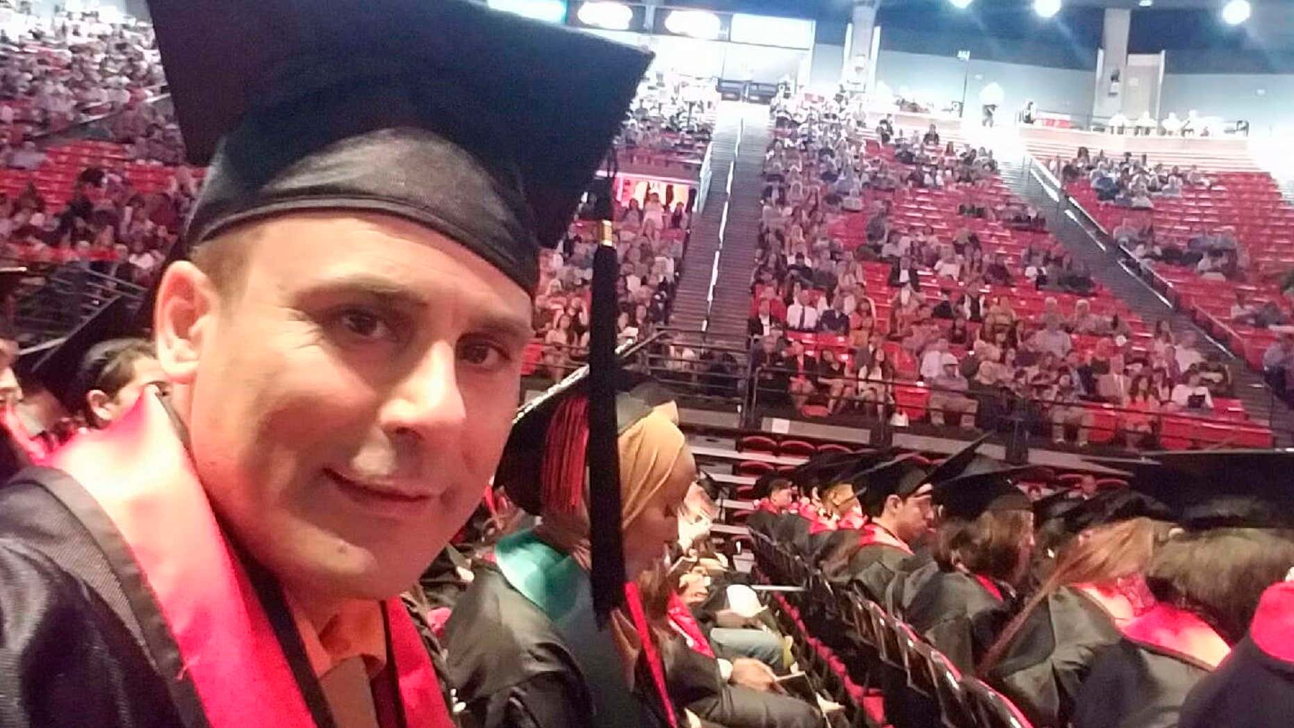 In this May 2016 photo released by a family member shows Robin Shahini during his International Security and Conflict Resolution San Diego State University graduation ceremony in San Diego, Calif.