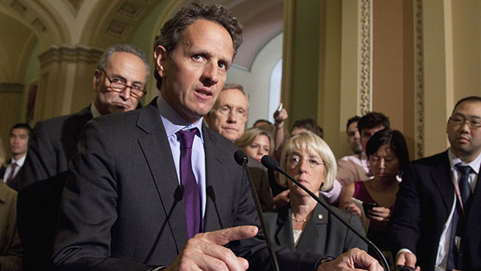 July 14: Treasury Secretary Timothy Geithner, second from left, makes remarks after a meeting with Democrats about the debt limit on Capitol Hill in Washington.