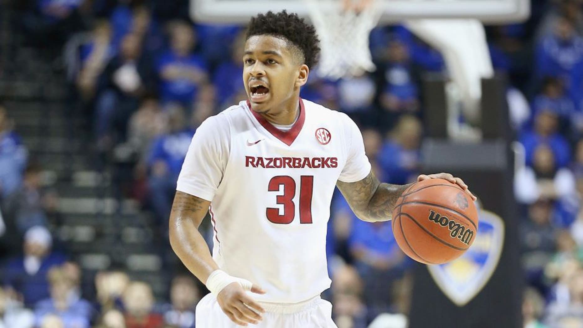 NASHVILLE, TN - MARCH 14: Anton Beard #31 of the Arkansas Razorbacks dribbles the ball in the game against the Georgia Bulldogs during the SEC Basketball Tournament Semifinals at Bridgestone Arena on March 14, 2015 in Nashville, Tennessee. (Photo by Andy Lyons/Getty Images)
