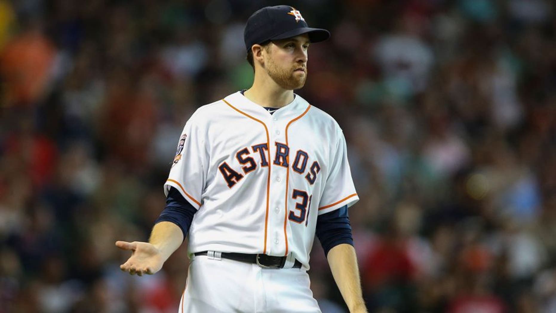 Jul 22, 2015; Houston, TX, USA; Houston Astros starting pitcher Collin McHugh (31) reacts after a play during the second inning against the Boston Red Sox at Minute Maid Park. Mandatory Credit: Troy Taormina-USA TODAY Sports