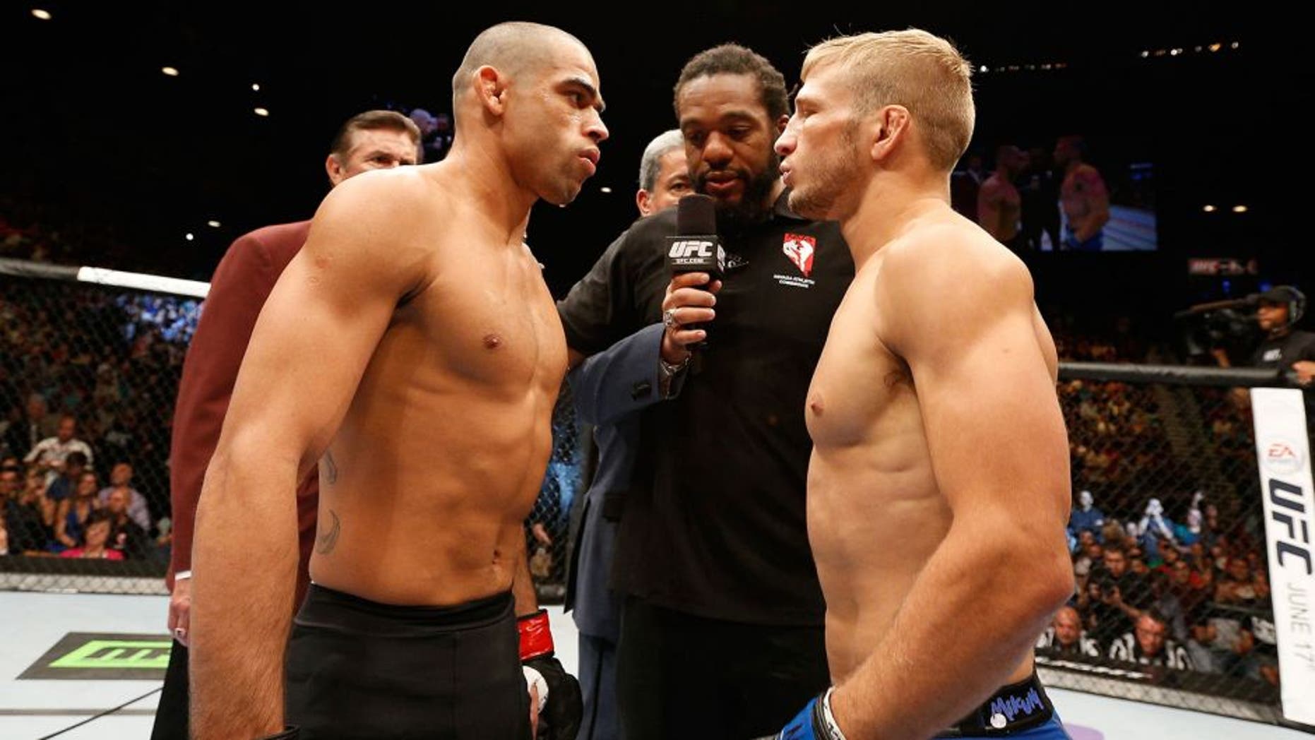 LAS VEGAS, NV - MAY 24: (L-R) Renan Barao and T.J. Dillashaw face off before their bantamweight championship bout during the UFC 173 event at the MGM Grand Garden Arena on May 24, 2014 in Las Vegas, Nevada. (Photo by Josh Hedges/Zuffa LLC/Zuffa LLC via Getty Images)
