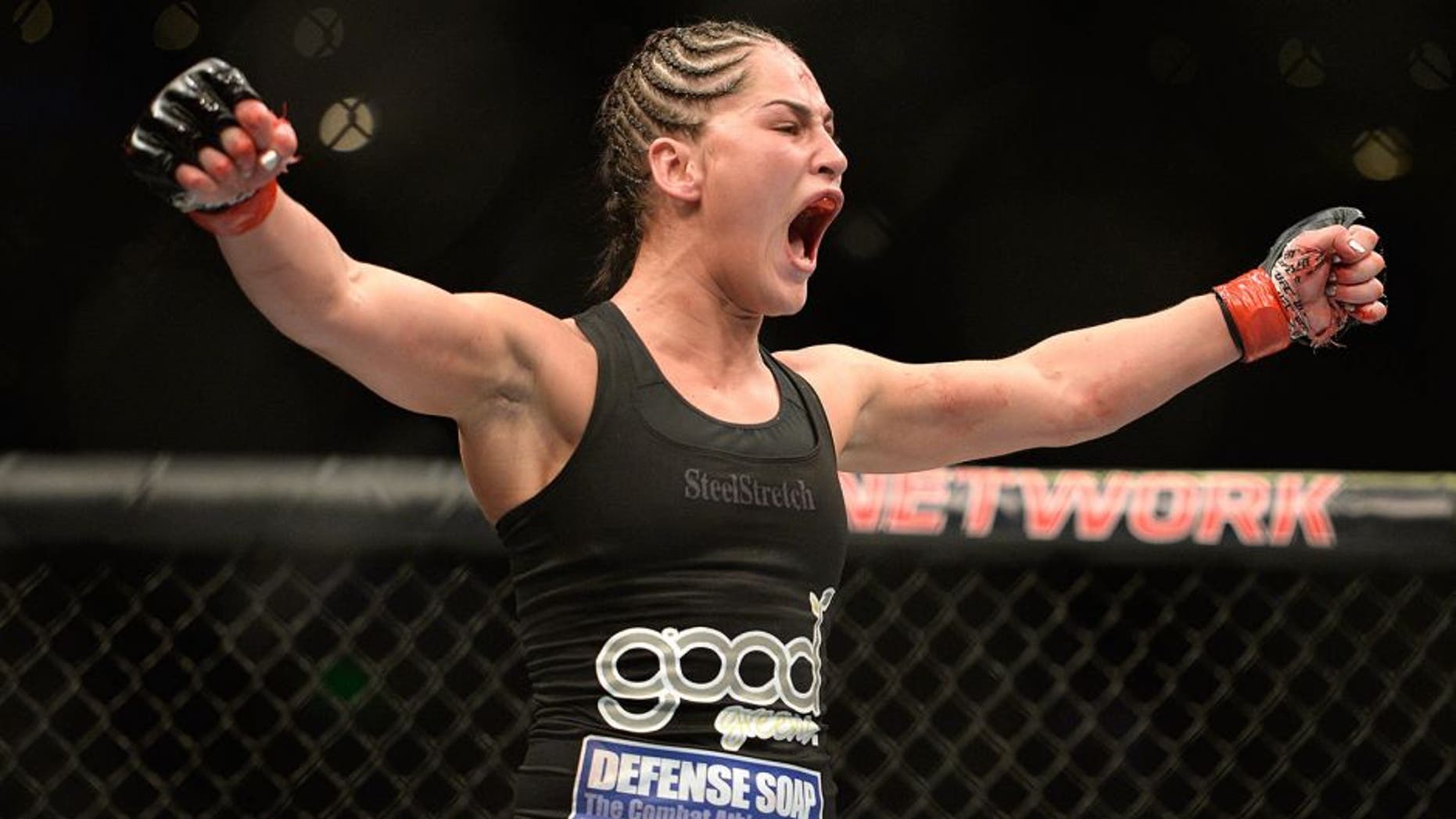 MEXICO CITY, MEXICO - NOVEMBER 15: Jessica Eye celebrates after defeating Leslie Smith in their women's bantamweight bout during the UFC 180 event at Arena Ciudad de Mexico on November 15, 2014 in Mexico City, Mexico. (Photo by Jeff Bottari/Zuffa LLC/Zuffa LLC via Getty Images)
