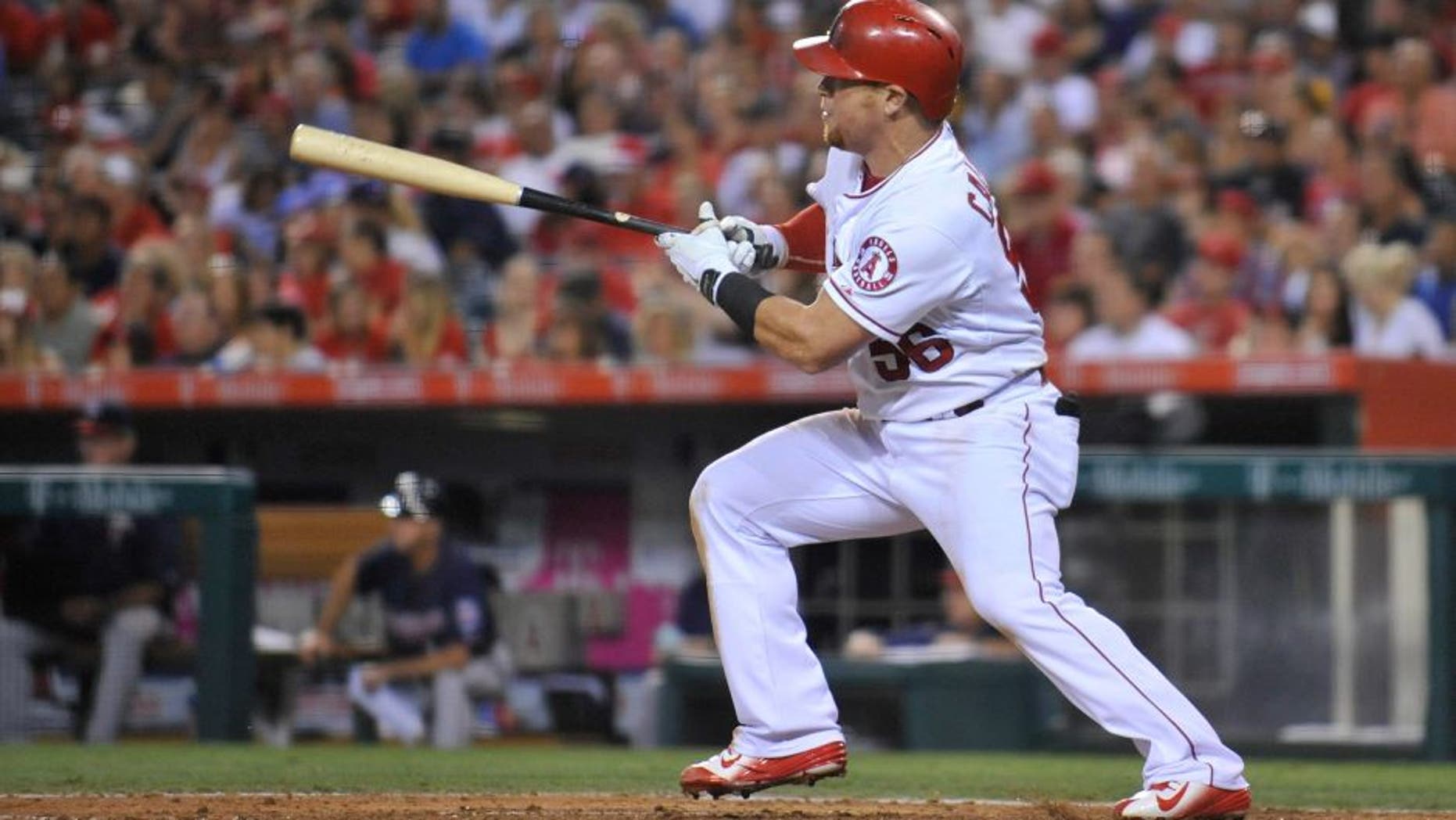 July 22, 2015; Anaheim, CA, USA; Los Angeles Angels right fielder Kole Calhoun (56) hits an RBI single in the fifth inning against the Minnesota Twins at Angel Stadium of Anaheim. Mandatory Credit: Gary A. Vasquez-USA TODAY Sports
