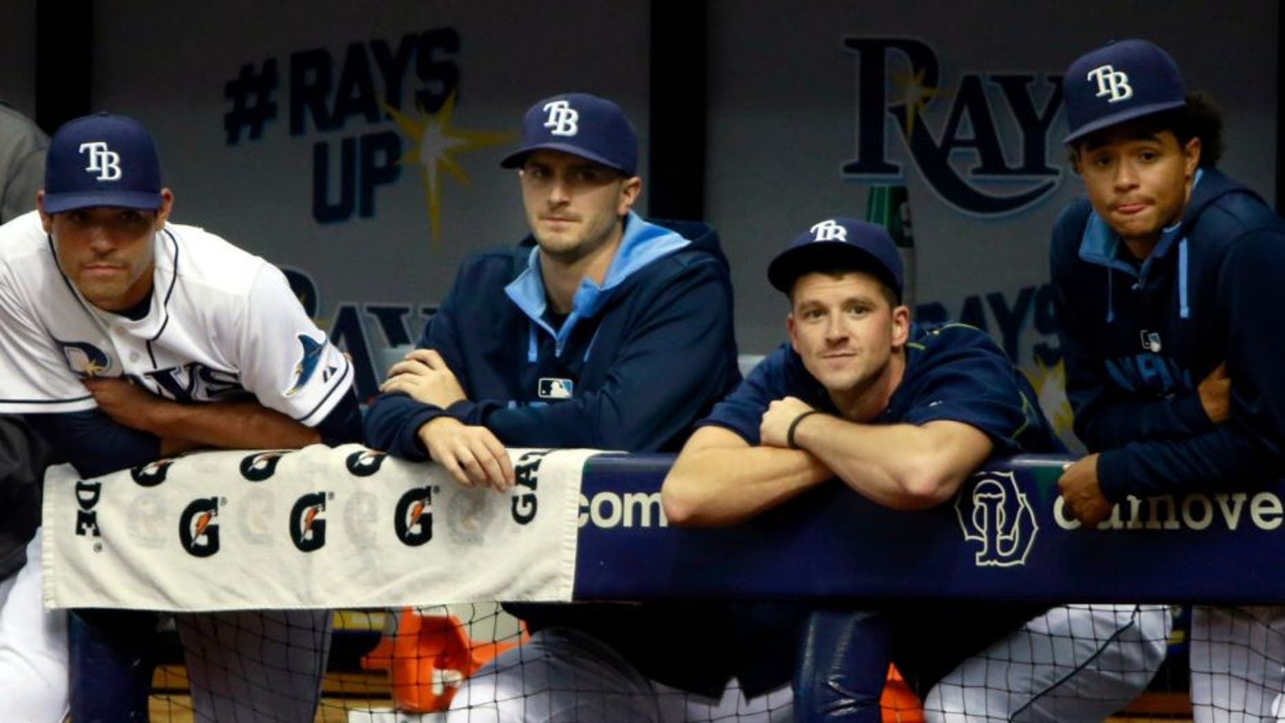 Jun 30, 2015; St. Petersburg, FL, USA; Tampa Bay Rays starting pitcher Alex Cobb (53), pitcher Matt Moore (55), pitcher Jake Odorizzi (23), pitcher Drew Smyly (33) and pitcher Chris Archer (22) look on from the dugout during the second inning against the Cleveland Indians at Tropicana Field. Mandatory Credit: Kim Klement-USA TODAY Sports