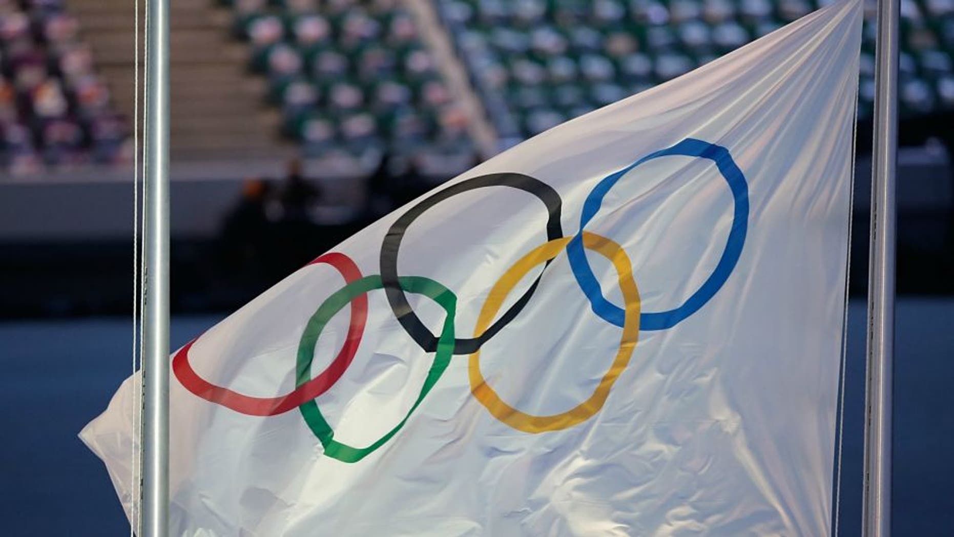 as part of the 2014 Sochi Winter Olympics Closing Ceremony at Fisht Olympic Stadium on February 23, 2014 in Sochi, Russia.,SOCHI, RUSSIA - FEBRUARY 23: The Olympic Flag waves as part of the 2014 Sochi Winter Olympics Closing Ceremony at Fisht Olympic Stadium on February 23, 2014 in Sochi, Russia. (Photo by Joe Scarnici/Getty Images)