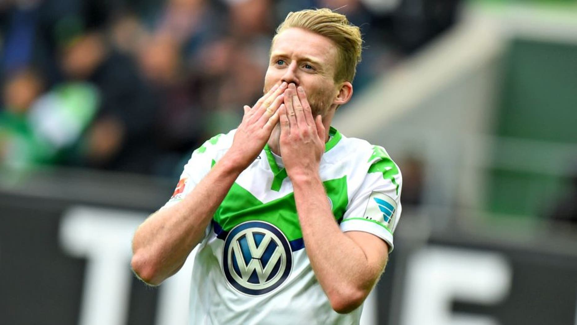 WOLFSBURG, GERMANY - MAY 14: Andre Schuerrle of Wolfsburg celebrates scoring his second goal during during the Bundesliga match between VfL Wolfsburg and VfB Stuttgart at Volkswagen Arena on May 14, 2016 in Wolfsburg, Germany. (Photo by Nigel Treblin/Bongarts/Getty Images)