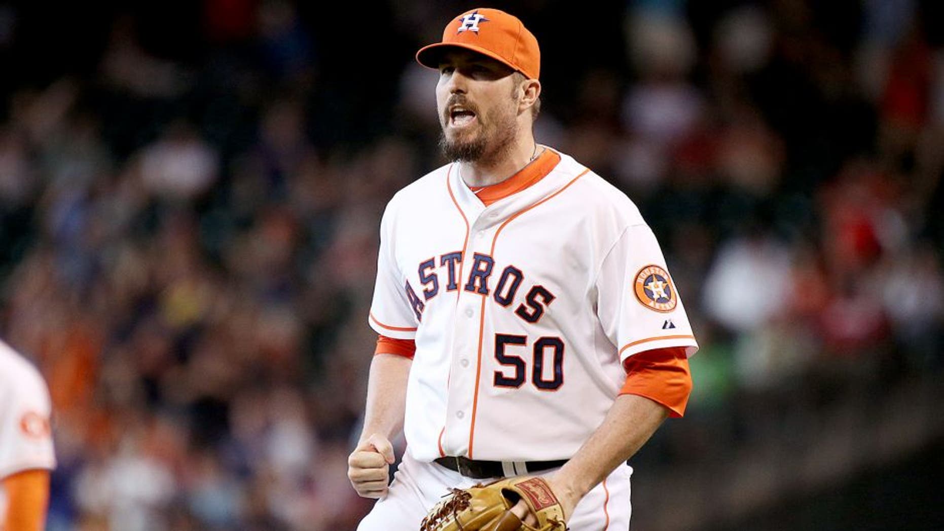 Jul 12, 2014; Houston, TX, USA; Houston Astros relief pitcher Chad Qualls (50) celebrates after defeating the Boston Red Sox 3-2 at Minute Maid Park. Mandatory Credit: Andrew Richardson-USA TODAY Sports