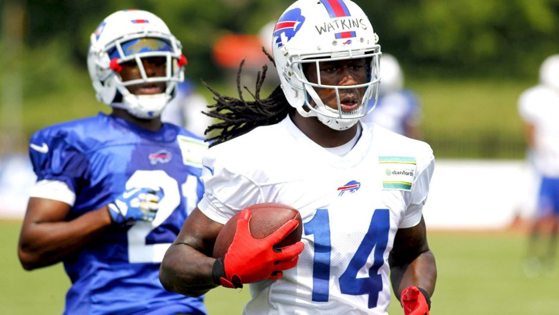 Buffalo Bills wide receiver Sammy Watkins (14) runs after a reception against corner back Leodis McKelvin (21) during their NFL football training camp in Pittsford, N.Y., Monday, July 21, 2014. (AP Photo/Bill Wippert)