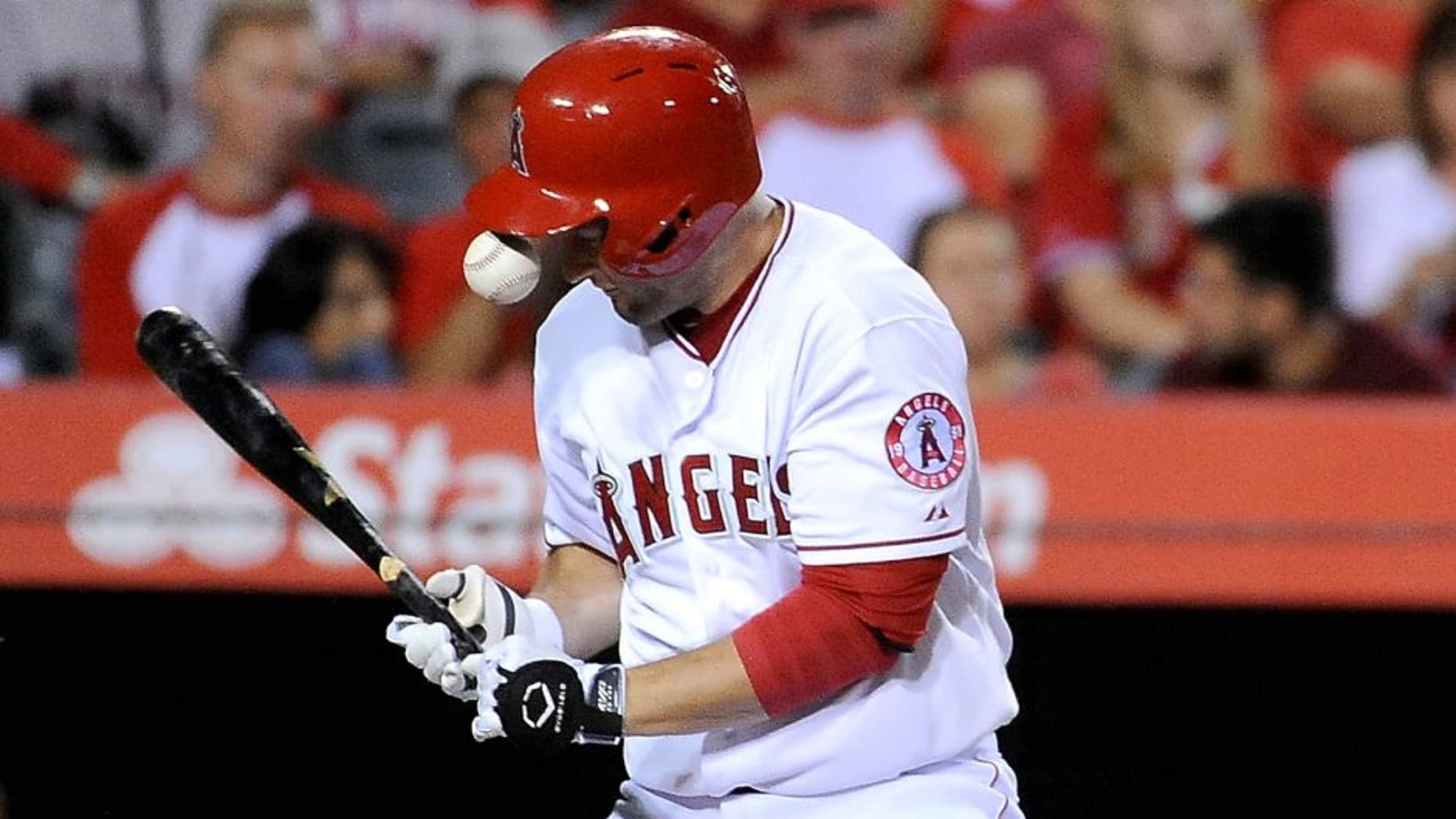 ANAHEIM, CA - JULY 22: David Freese #6 of the Los Angeles Angels of Anaheim is hit in the hand by a ball in the fourth inning during a game against the Minnesota Twins at Angel Stadium of Anaheim on July 22, 2015 in Anaheim, California. (Photo by Jonathan Moore/Getty Images)