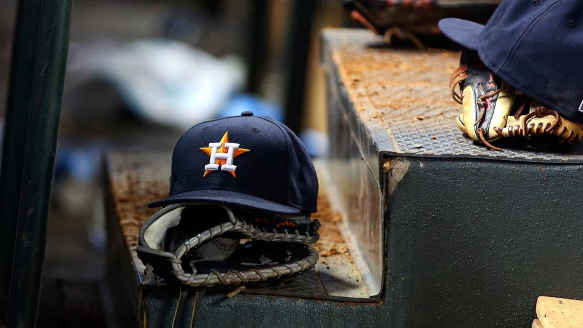May 4, 2015; Houston, TX, USA; General view of Houston Astros caps and gloves in the dugout during the game against the Texas Rangers at Minute Maid Park. Mandatory Credit: Troy Taormina-USA TODAY Sports