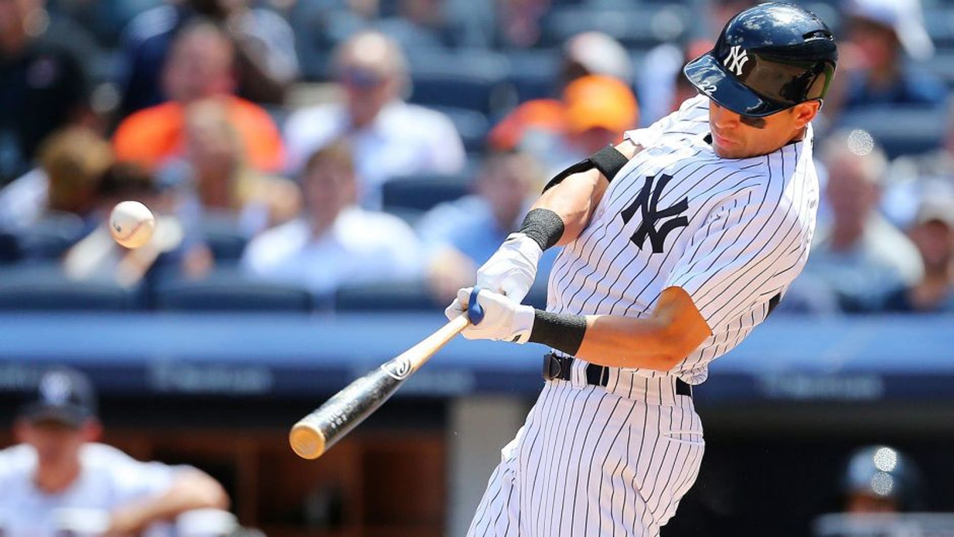 NEW YORK, NY - JULY 23: Jacoby Ellsbury #22 of the New York Yankees hits a two run double in the fifth inning against the Baltimore Orioles at Yankee Stadium on July 23, 2015 in the Bronx borough of New York City. (Photo by Mike Stobe/Getty Images)
