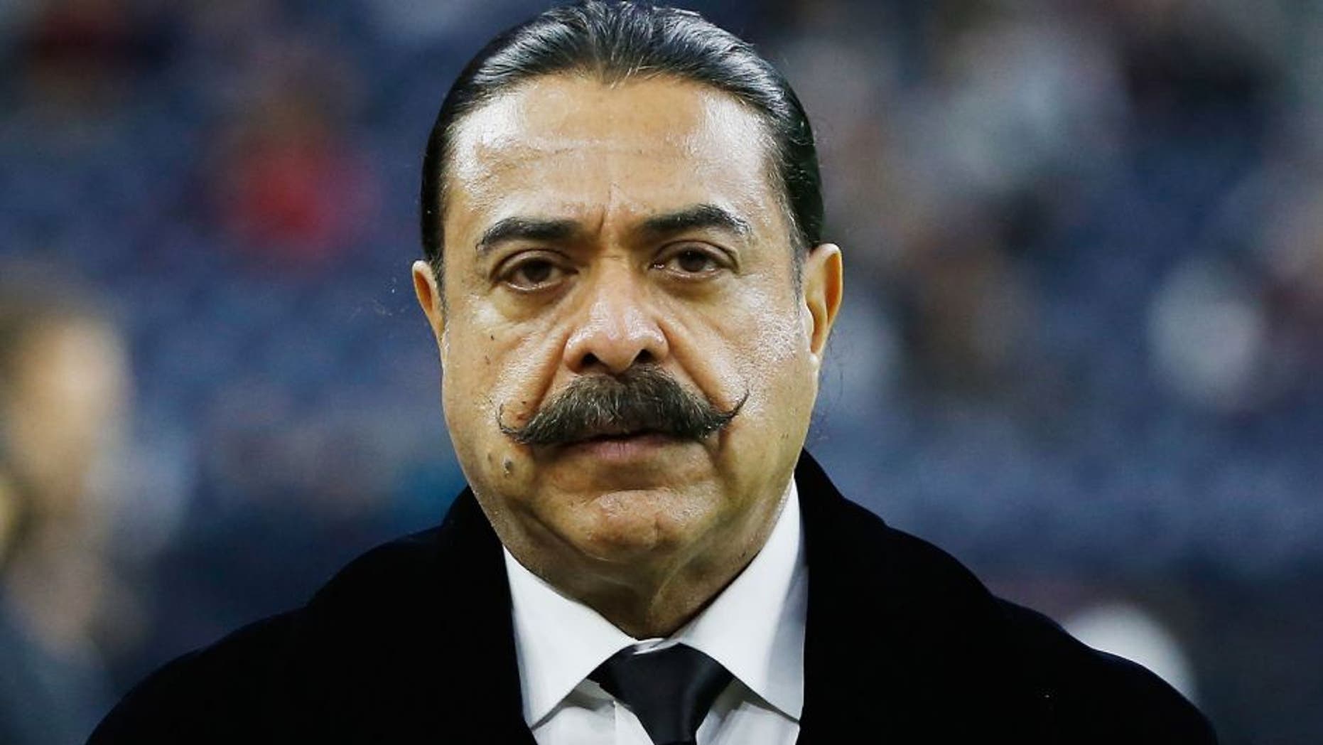 HOUSTON, TX - DECEMBER 28: Shahid Khan, the billionaire owner of the Jacksonville Jaguars, waits on the field before their game against the Houston Texans at NRG Stadium on December 28, 2014 in Houston, Texas. (Photo by Scott Halleran/Getty Images)