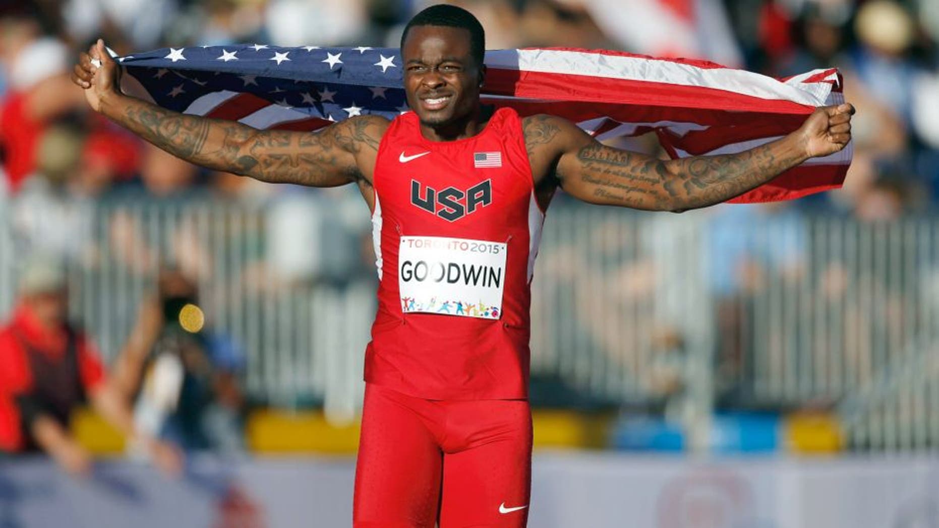 Jul 22, 2015; Toronto, Ontario, CAN; Marquise Goodwin of the United States celebrates after placing second in the men's athletics long jump final during the 2015 Pan Am Games at CIBC Pan Am Athletics Stadium. Mandatory Credit: Erich Schlegel-USA TODAY Sports