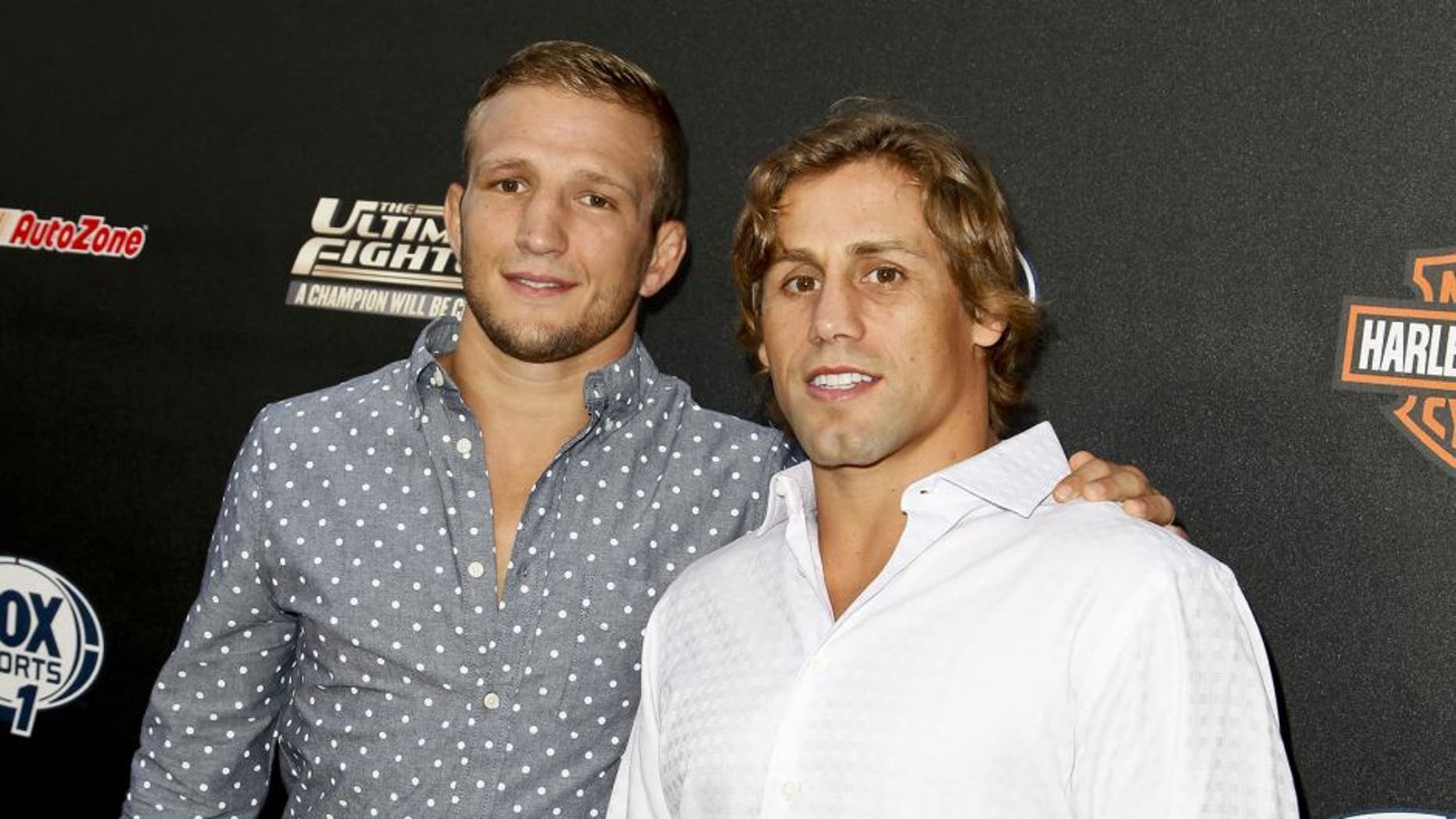 HOLLYWOOD, CA - SEPTEMBER 09: (L-R) TJ Dillashaw and Urijah Faber attend FOX Sports 1's 'The Ultimate Fighter' season premiere party at Lure on September 9, 2014 in Hollywood, California. (Photo by Tibrina Hobson/WireImage)