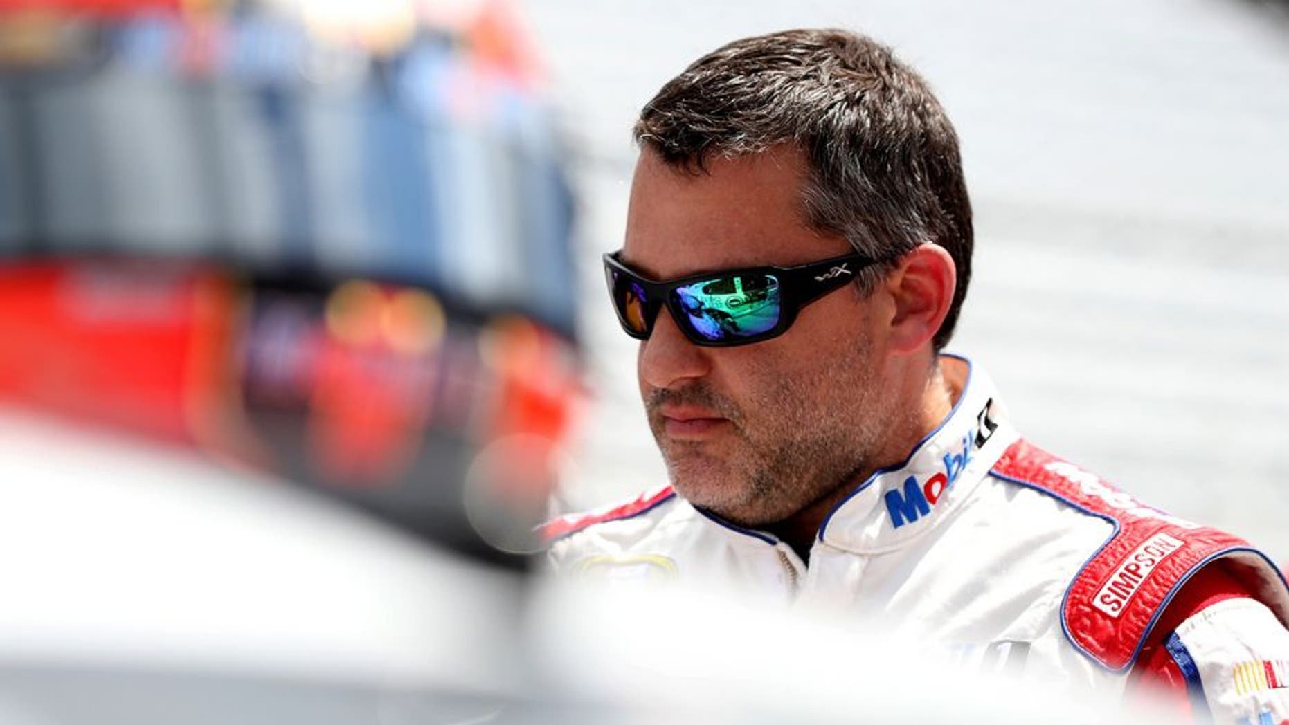 INDIANAPOLIS, IN - JULY 23: Tony Stewart, driver of the #14 Mobil 1/Chevy Summer Sell Down Chevrolet, stands on the grid during qualifying for the NASCAR Sprint Cup Series Crown Royal Presents The Combat Wounded Coalition 400 at Indianapolis Motor Speedway on July 23, 2016 in Indianapolis, Indiana. (Photo by Sean Gardner/NASCAR via Getty Images)