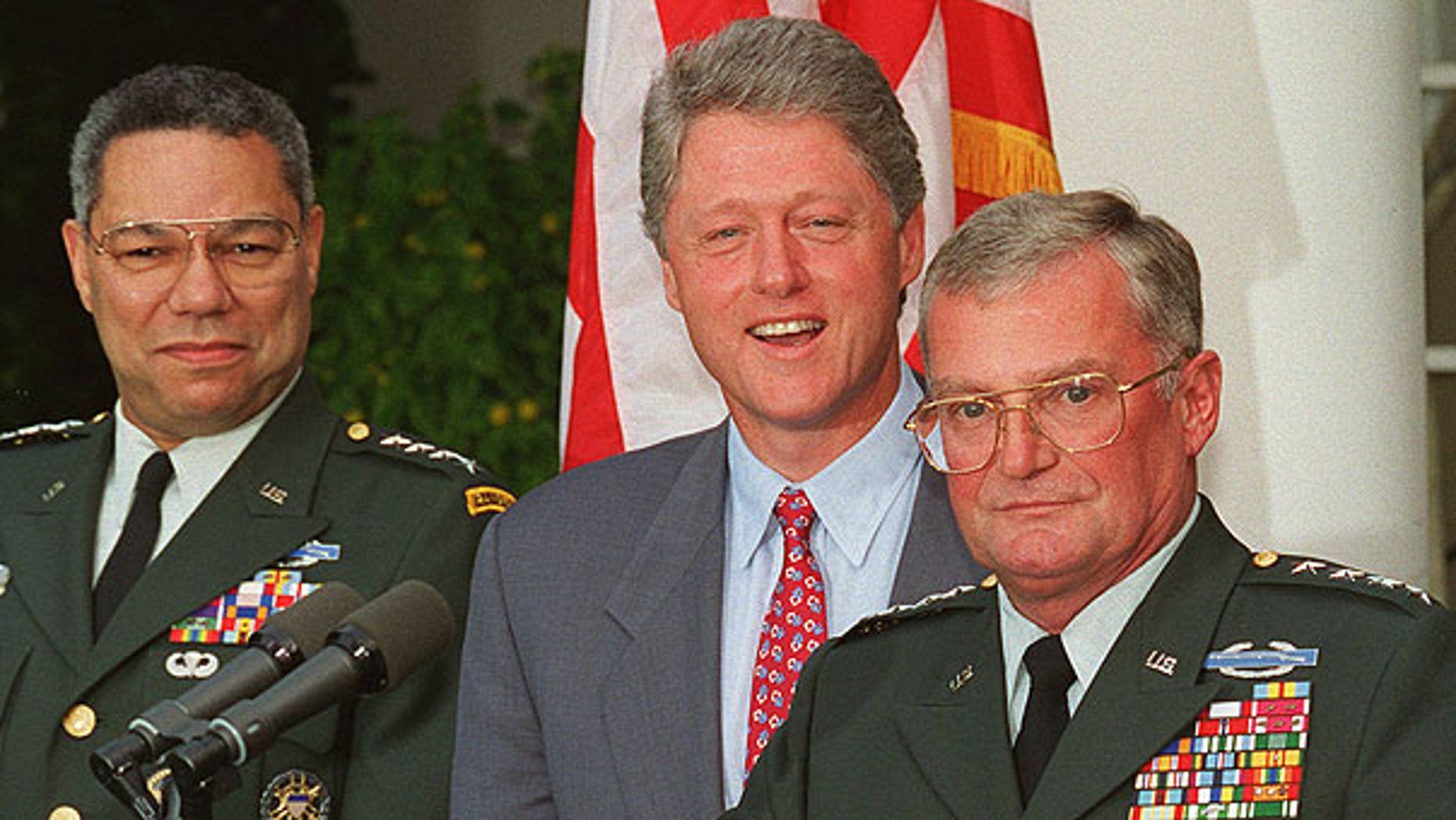In this Aug. 11, 1993 file photo, Army Gen. John Shalikashvili speaks in the Rose Garden of the White House in Washington accompanied by President Bill Clinton and Joint Chiefs Chairman Gen. Colin Powell.