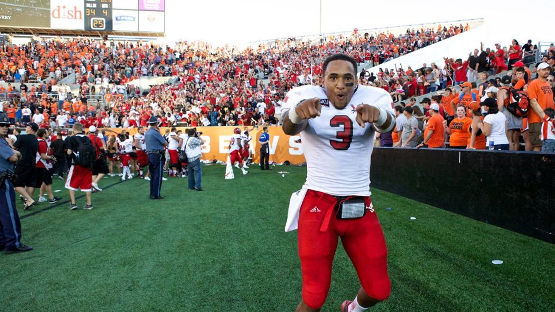 Aug 31, 2013; Corvallis, OR, USA; Eastern Washington Eagles quarterback Vernon Adams (3) celebrates with fans after defeating the Oregon State Beavers 49-46 at Reser Stadium. Mandatory Credit: Jaime Valdez-USA TODAY Sports